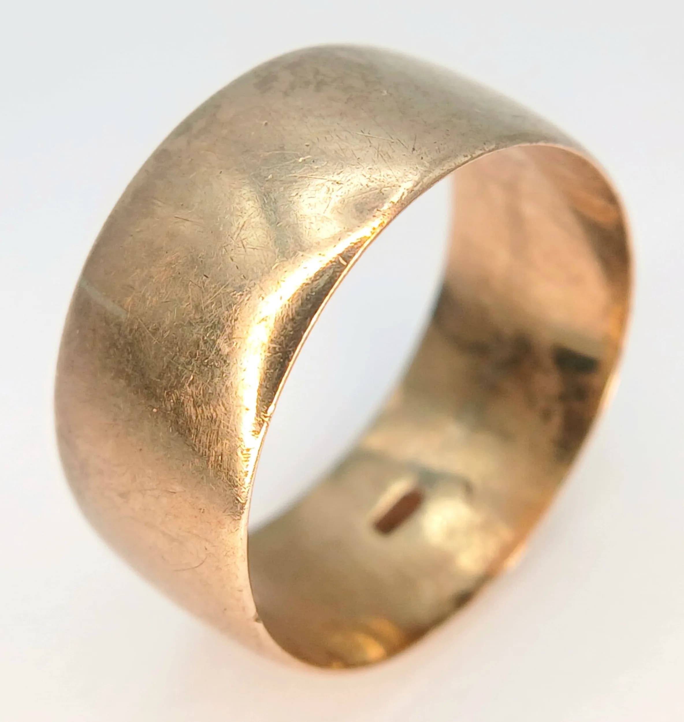 A 9K Yellow Gold Band Ring. 10mm width. Size T. 5.4g.