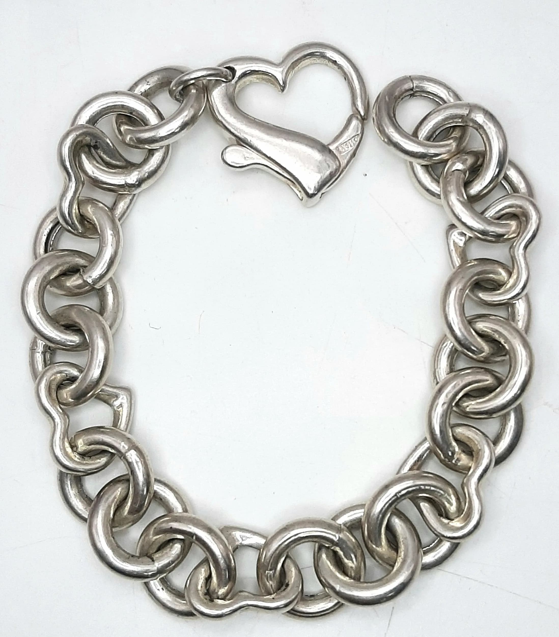 An Italian 925 Silver Heart and Circle Link Bracelet. Heart clasp. 17cm. 30g.