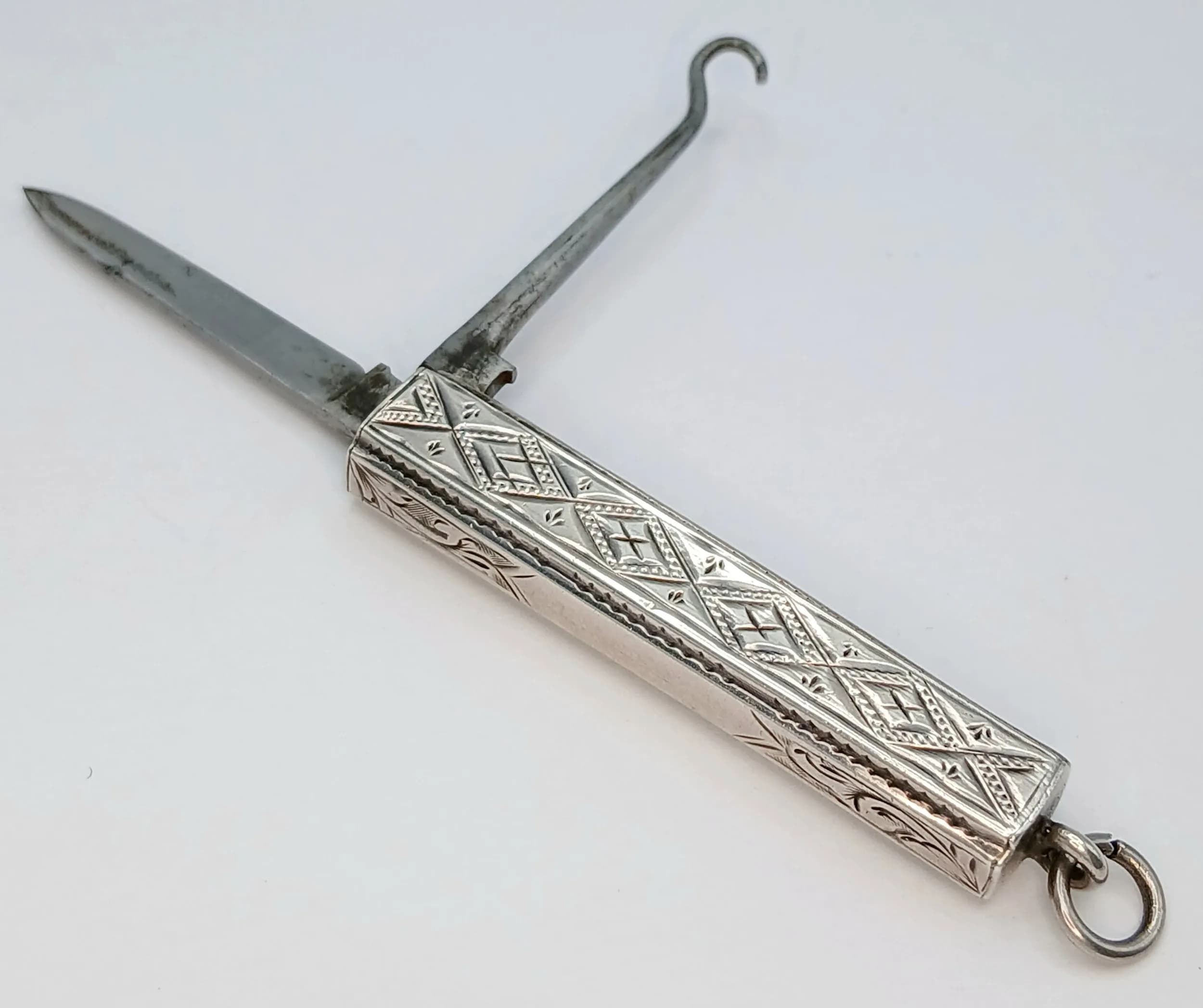 Ladies Rare Antique SILVER Travelling Folding BUTTON HOOK with KNIFE. Beautifully decorated with Clear hallmark for Francis Webb, Birmingham 1888. Approx 4.5 cm. Full working order, Excellent condition, please see pictures.