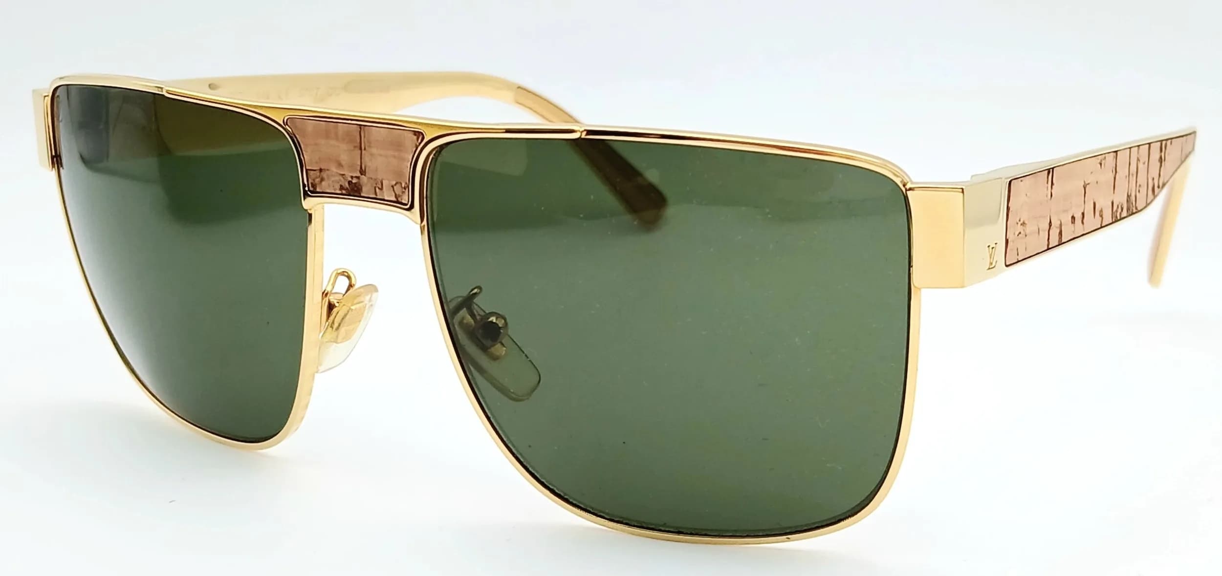 A Pair of Louis Vuitton Attitude Pilot Sunglasses. Gold-tone metal frames with a distinctive square navigator shape and dark tinted lenses. Comes with case and dust cover bag. Please see photos or request a condition report. Ref: 29585.