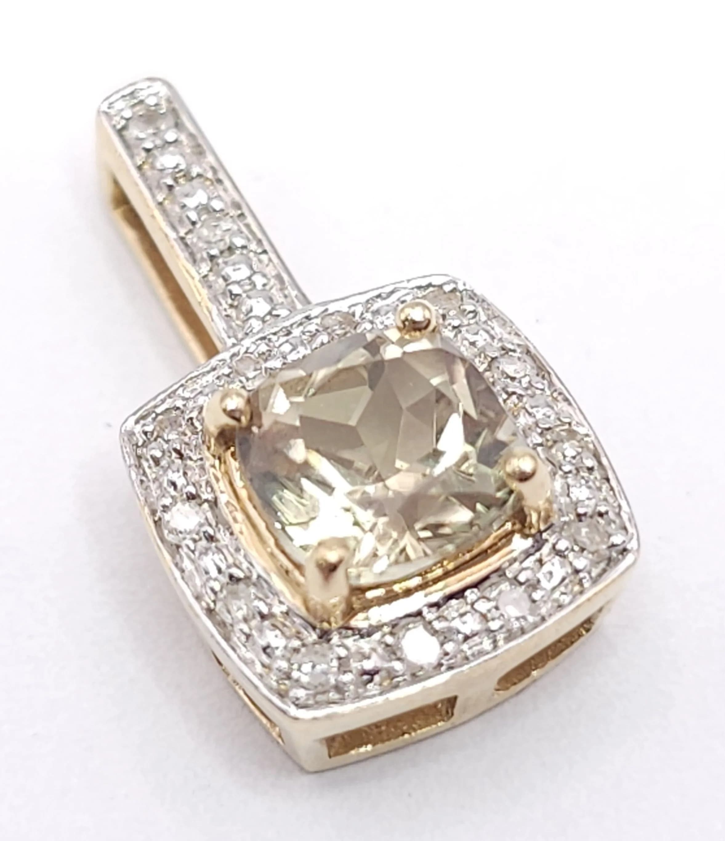 A 14K YELLOW GOLD, DIAMOND AND LEMON QUARTZ SET PENDANT. 2.2G. SC 7037