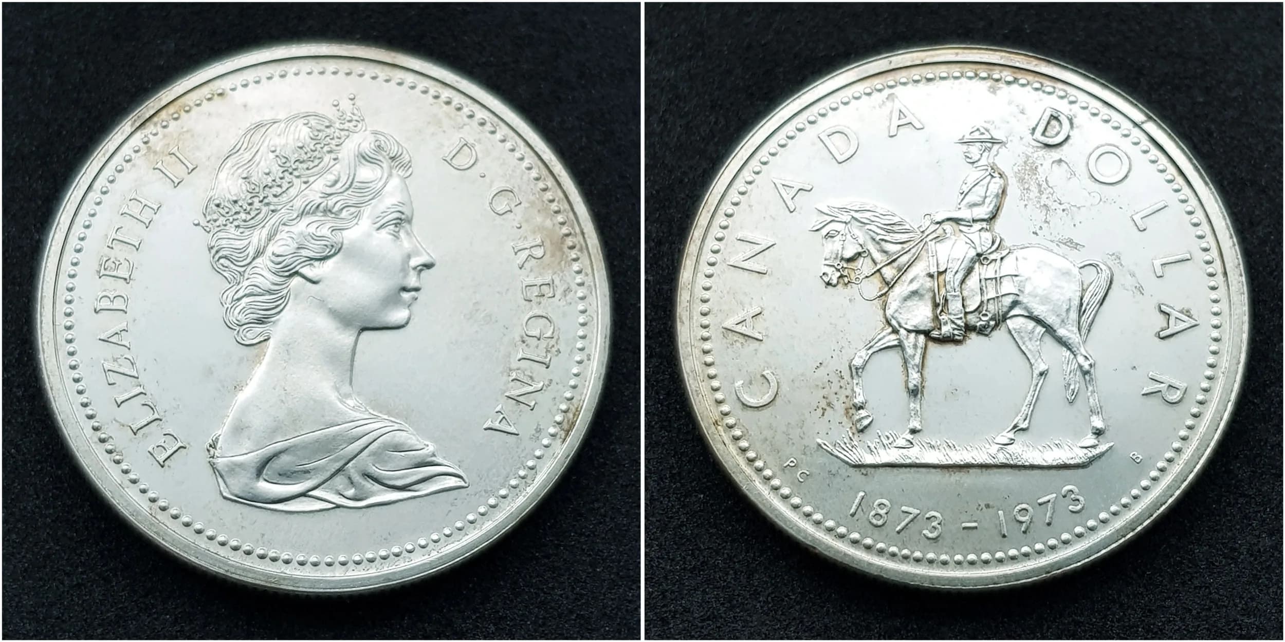 1973 CANADIAN SILVER DOLLAR coin. Minted to commemorate 100 years of the Royal Canadian Mounted Police (MOUNTIES) . Complete with original case. Condition brilliant and uncirculated.
