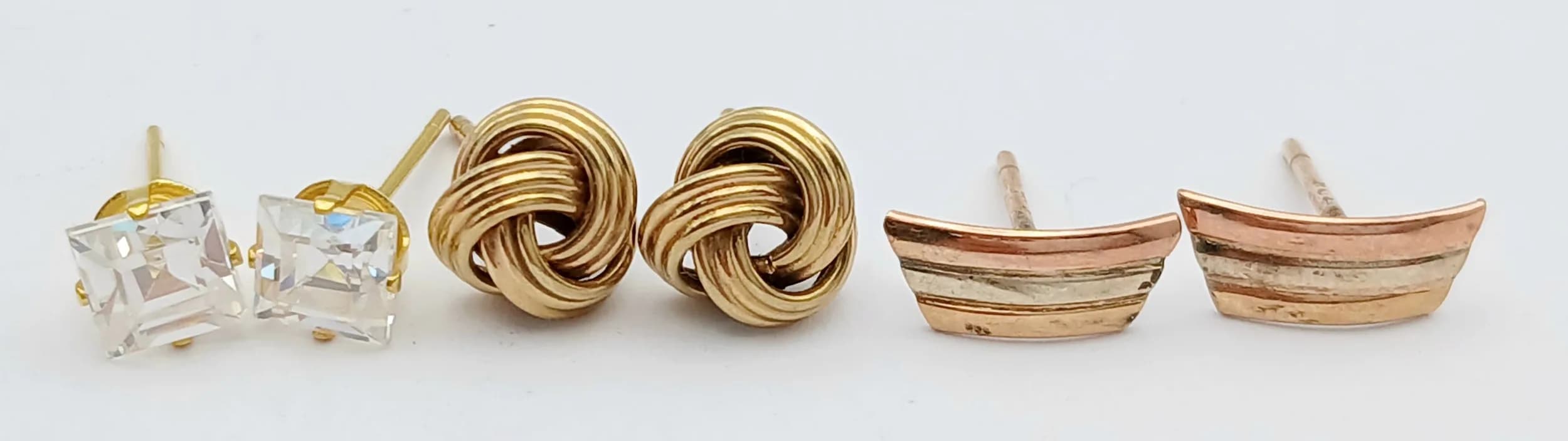 Three Pairs of 9K Gold Different Style Stud Earrings. No backs. 3g total weight.