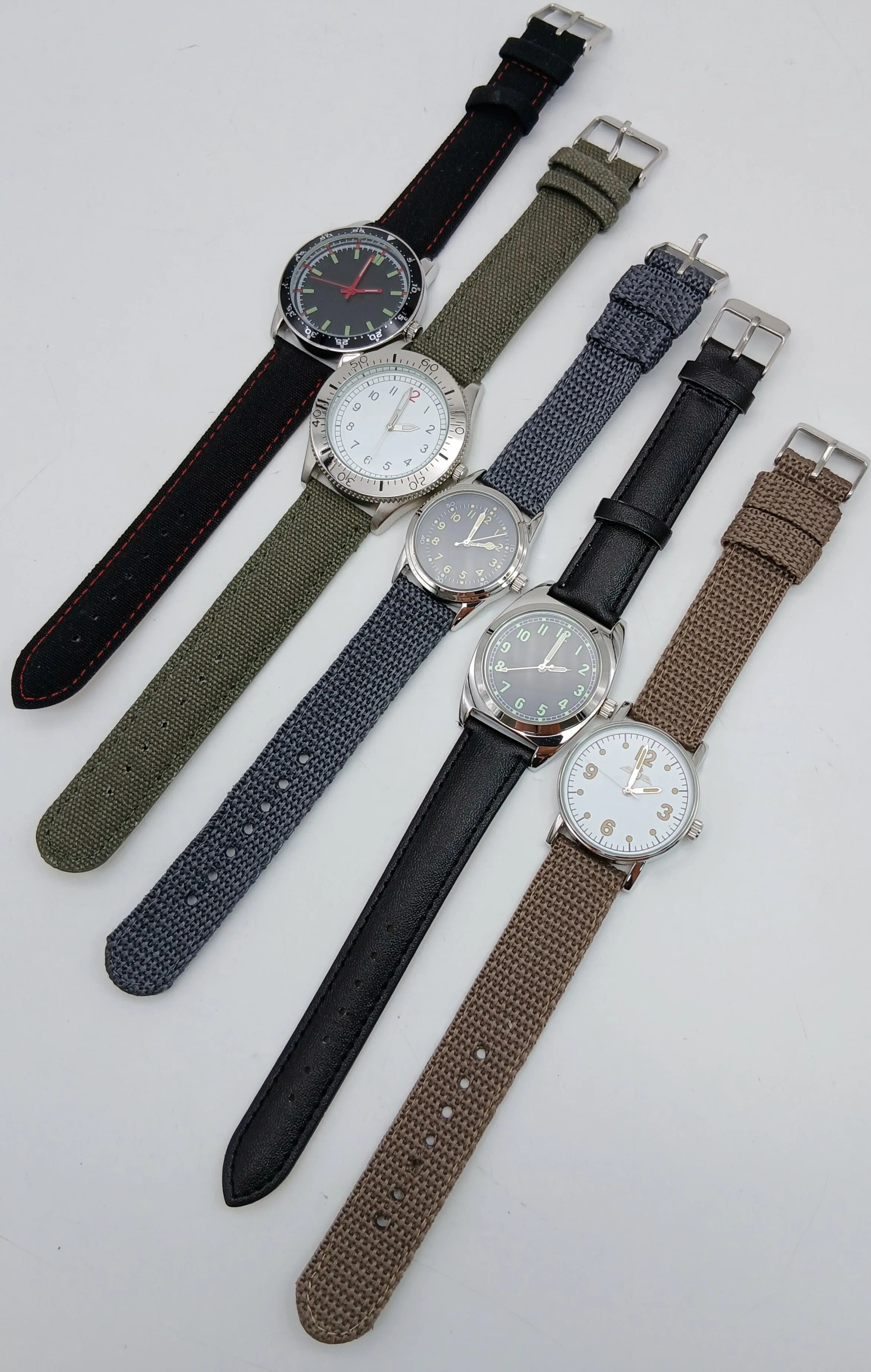 A Parcel of Five Boxed Military Design Watches. Comprising: 1) British RAF Navigator (43mm case), 2) United States Naval Diver (31mm case), 3) Swedish Soldier (35mm case), 4) Canadian Airforce (33mm Case) and 5) Portuguese Colonial (40mm Case). All having had recent battery replacements.