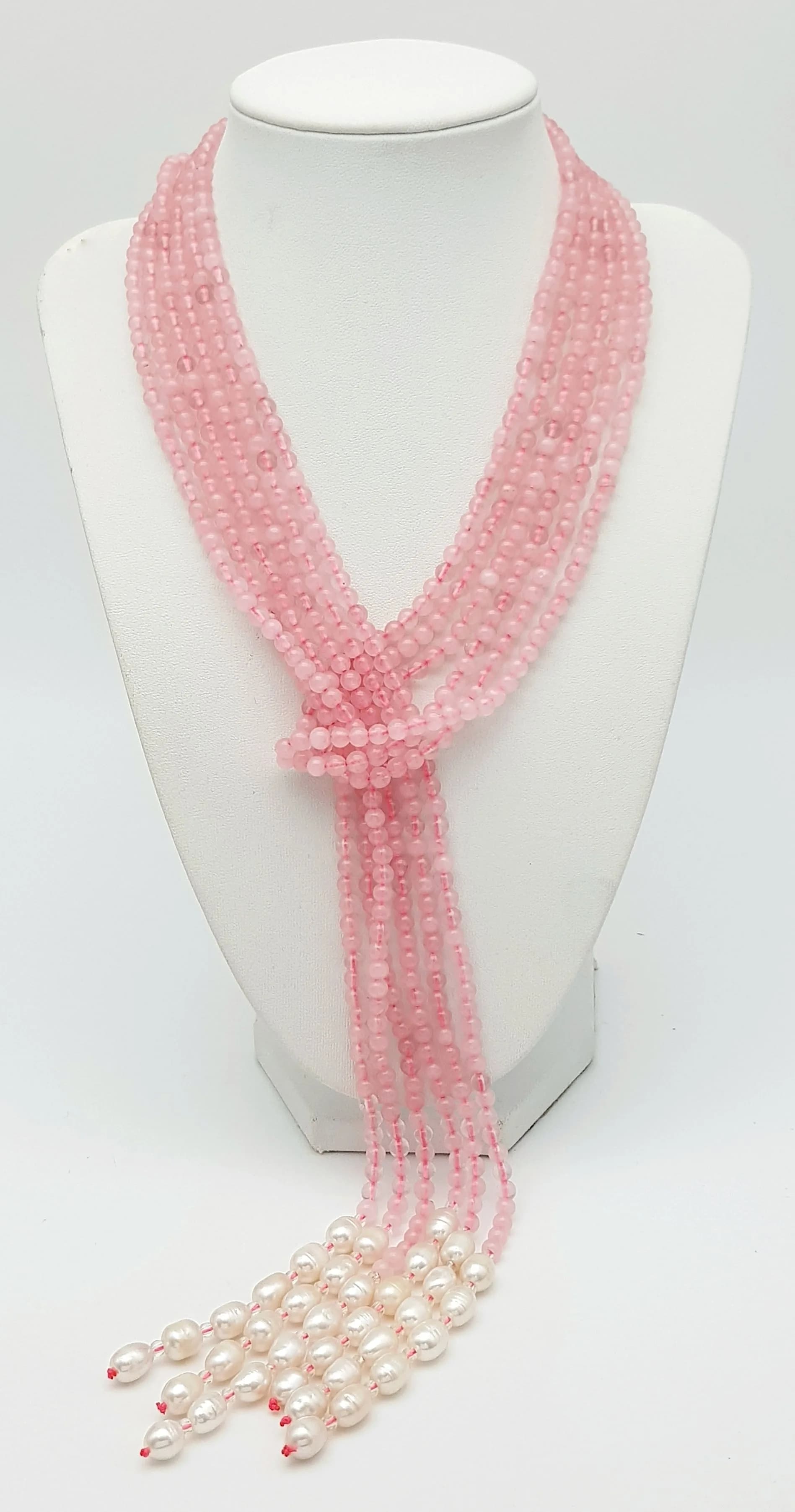 A Pink Jade and Freshwater Pearl Three Strand Scarf Necklace. Each strand circa 125cm.