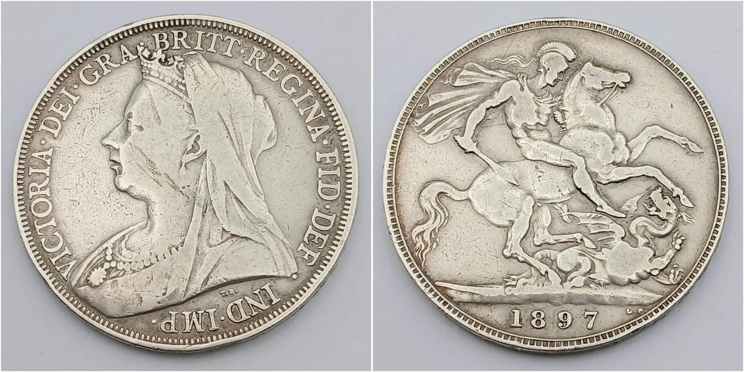 1897 SILVER CROWN coin. Scarce Date due to low Mintage. Very fine/extra fine condition. Please see pictures.