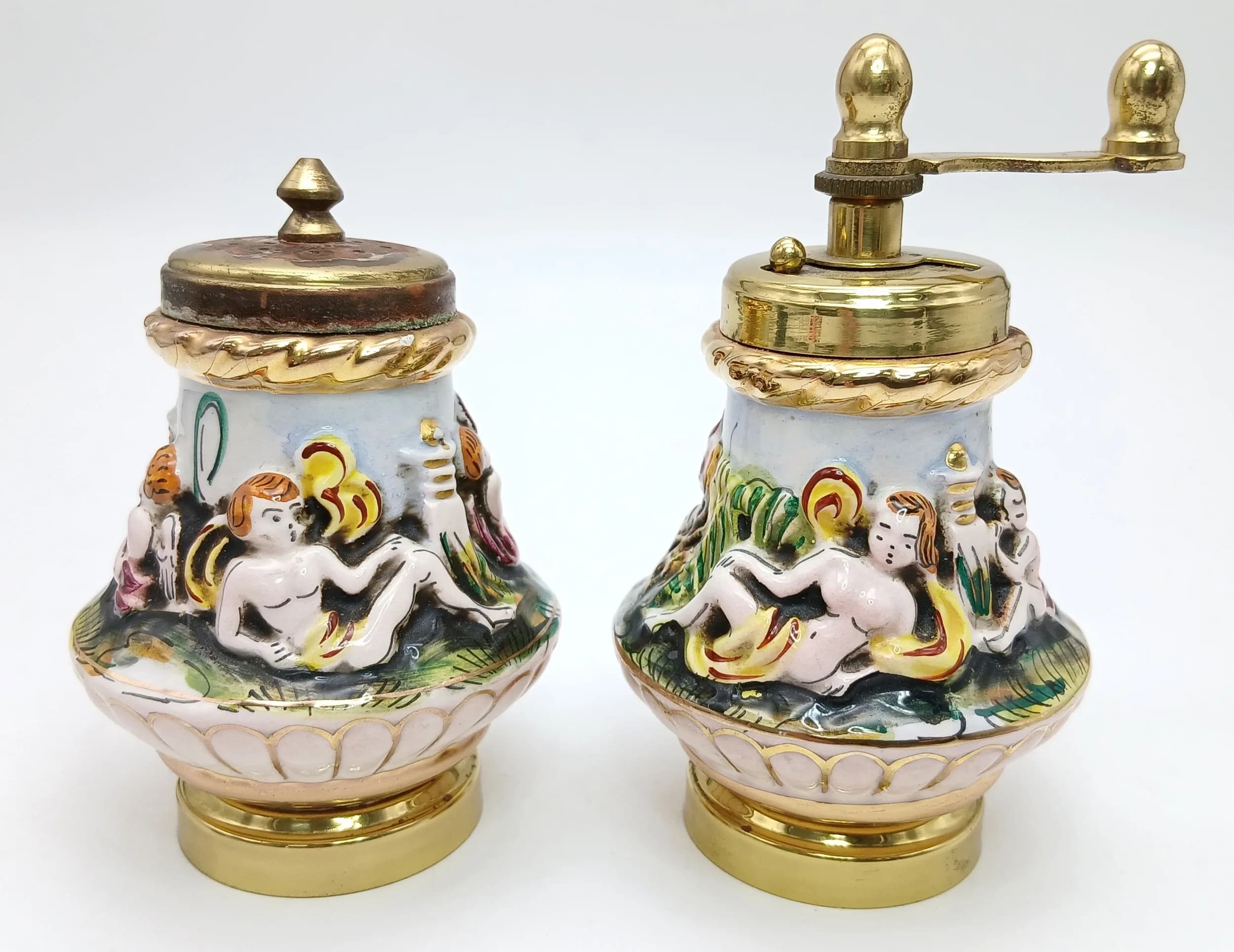 A vintage, Italian, Capodimonte porcelain salt shaker & pepper grinder with gilded mounts. A bit of wear to the gilding on the salt shaker, otherwise, good condition.
