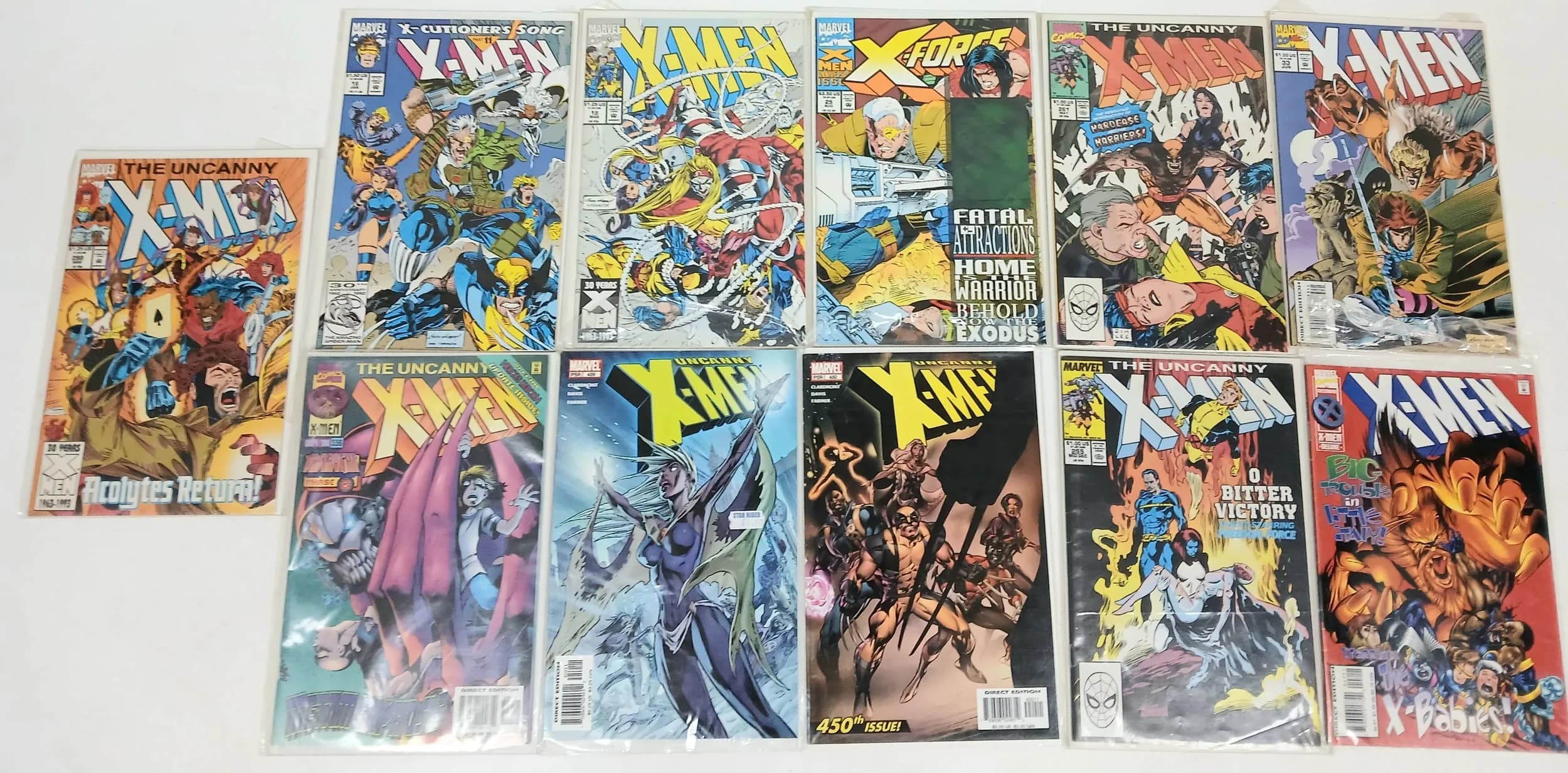 Eleven Marvel X MEN comics. All plastic wrapped. Please see photos for finer details.