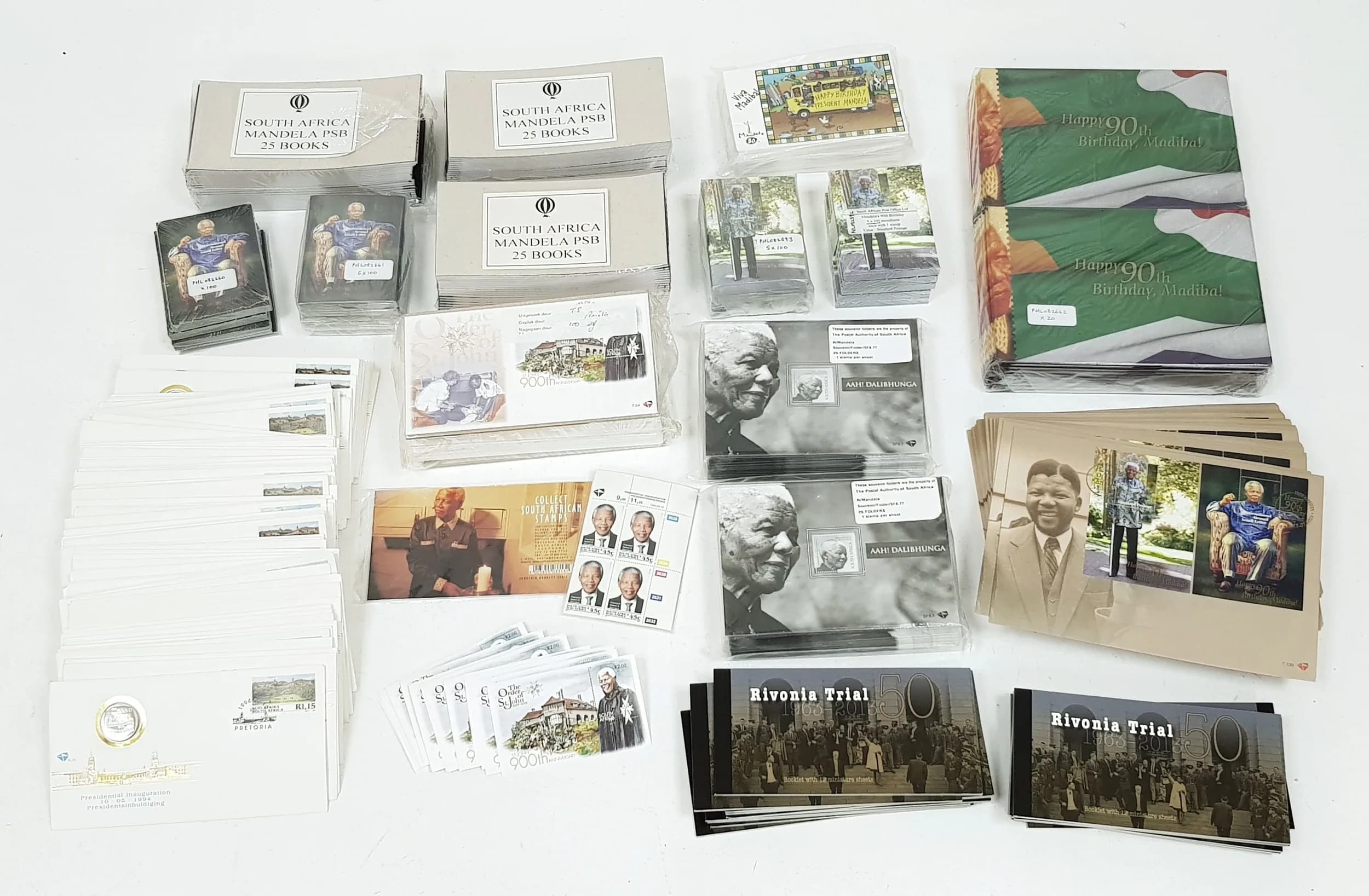 A job lot of Nelson Mandela first day cover stamp and coin sets. Most are still factory sealed.