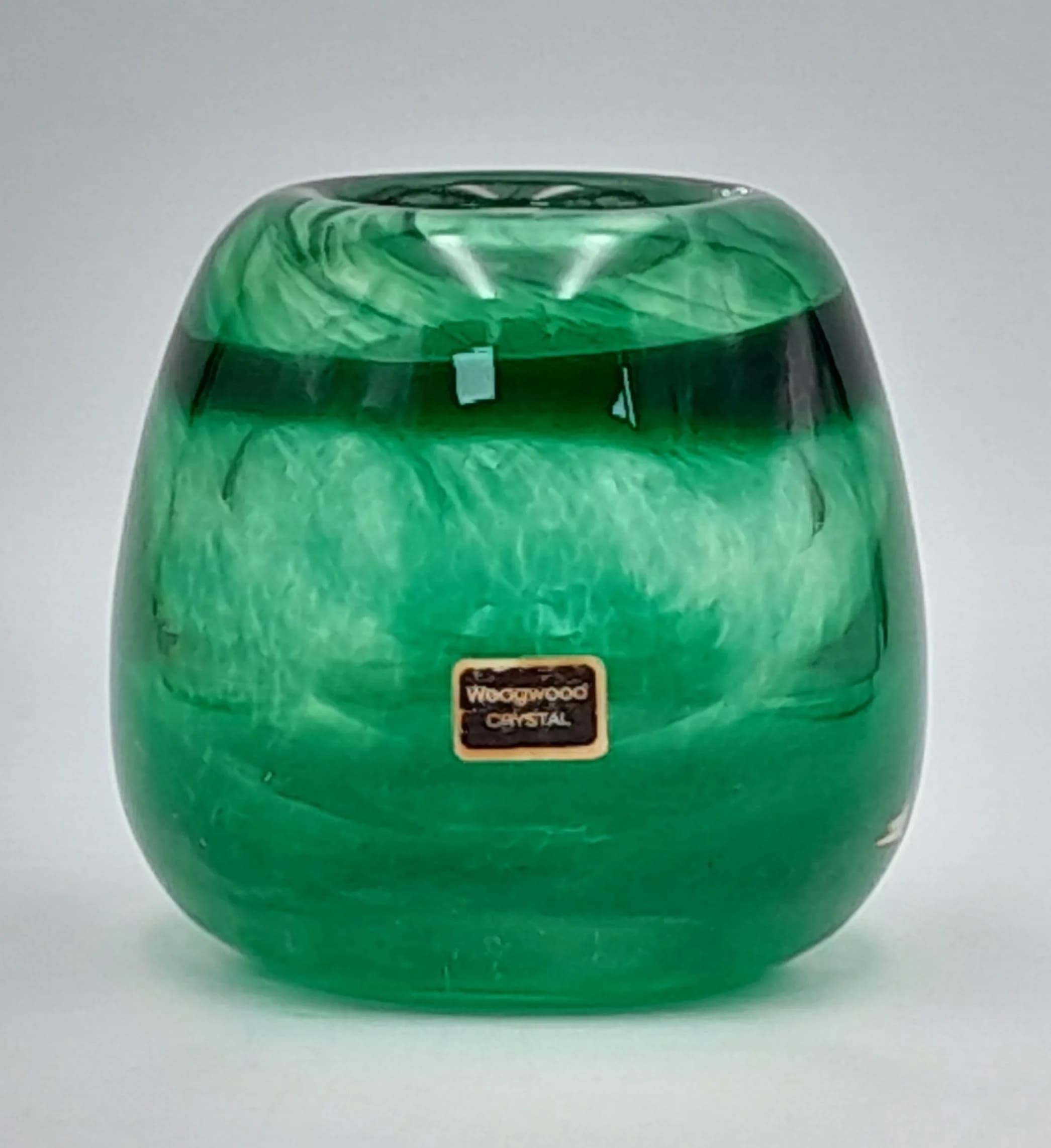A beatifull Wedgewood, emerald green rose bowl vase. It has the original Wedgewood sticker. In excellent condition, no chips or cracks.
