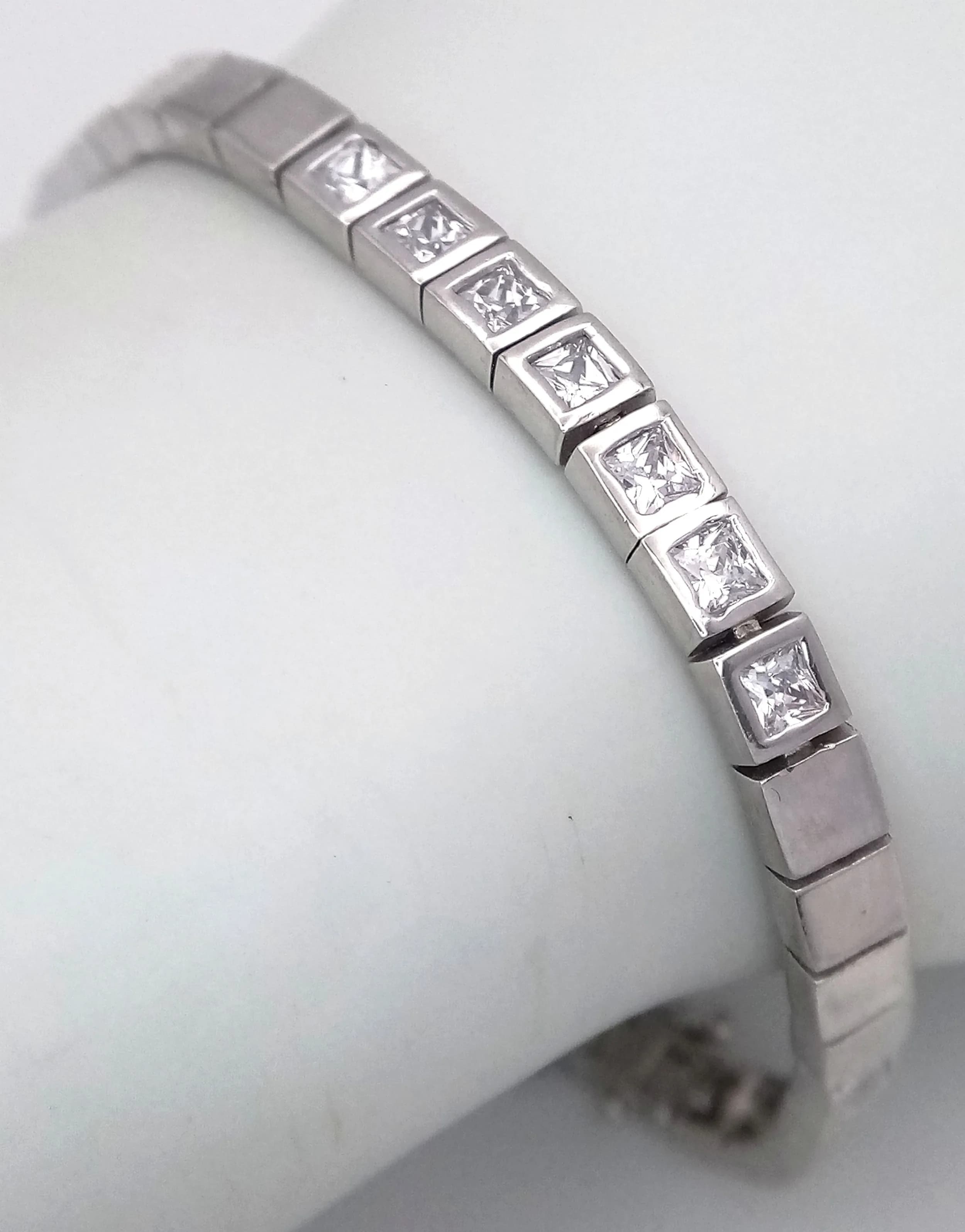 A Sterling Silver Contemporary Design Cubic Zirconia Bracelet- 19cm Length. 5mm Width. 12.93 grams.