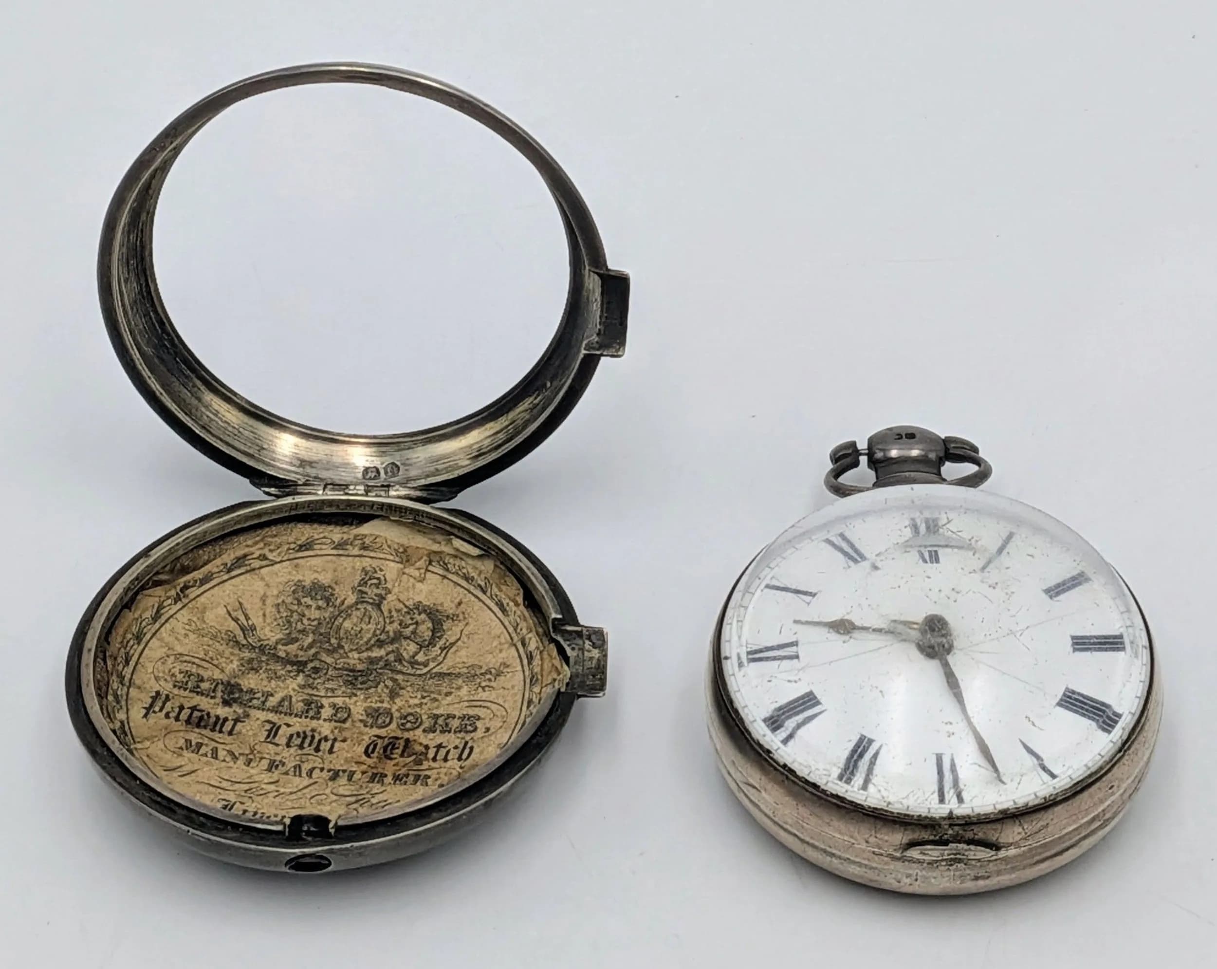 An Antique Sterling Silver Double Cased Pocket Watch. 58mm diameter. Hallmarked. AS FOUND. 160g total weight.