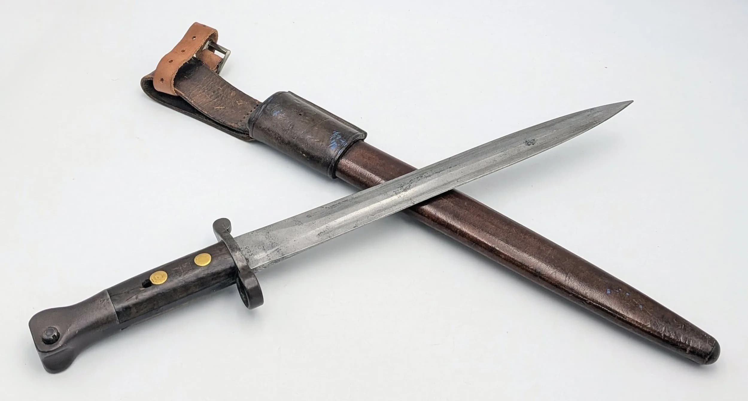 An Antique British Lee Enfield Dagger Bayonet. War department markings. Comes with leather scabbard. 30cm blade length. In good condition but please see photos. UK mainland shipping only or arrange a courier.