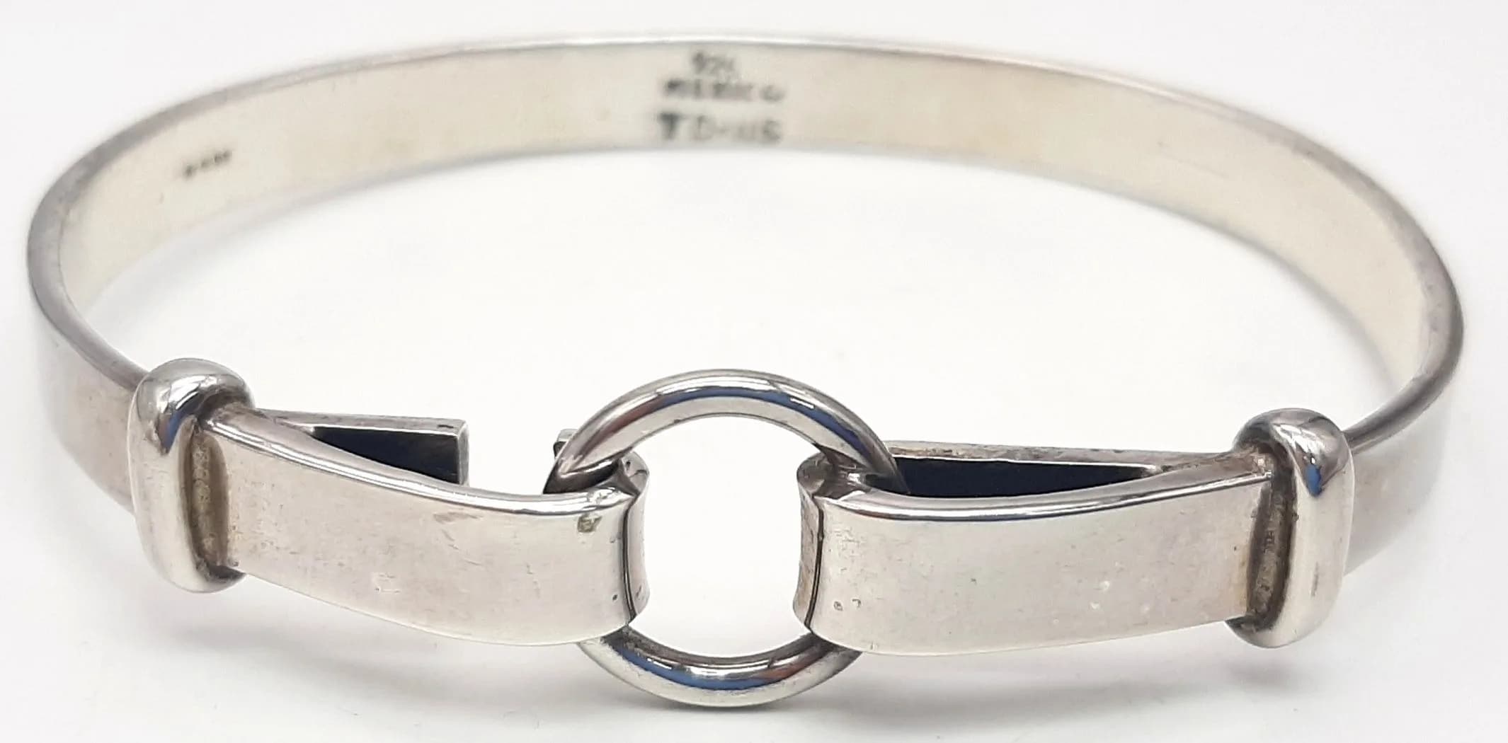 A 925 Silver Mexican Cuff Bangle. Open cuff design with central ring link decoration. Marked 925 Mexico. Total weight 23 grams.
