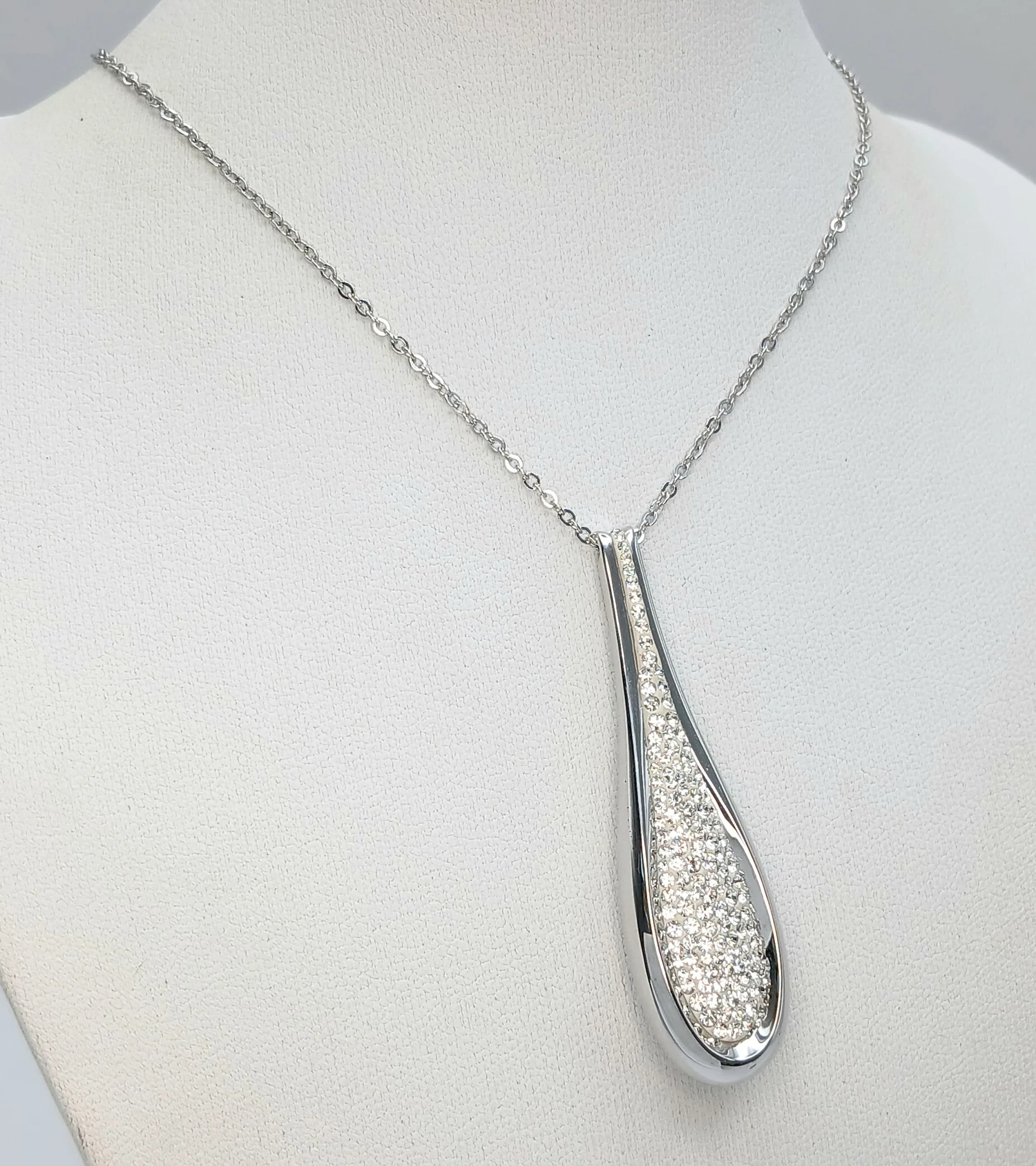 A Swarovski Cycle Pendant Necklace. Crystal set pendant on a 56cm chain. Pendant measures 5cm drop.