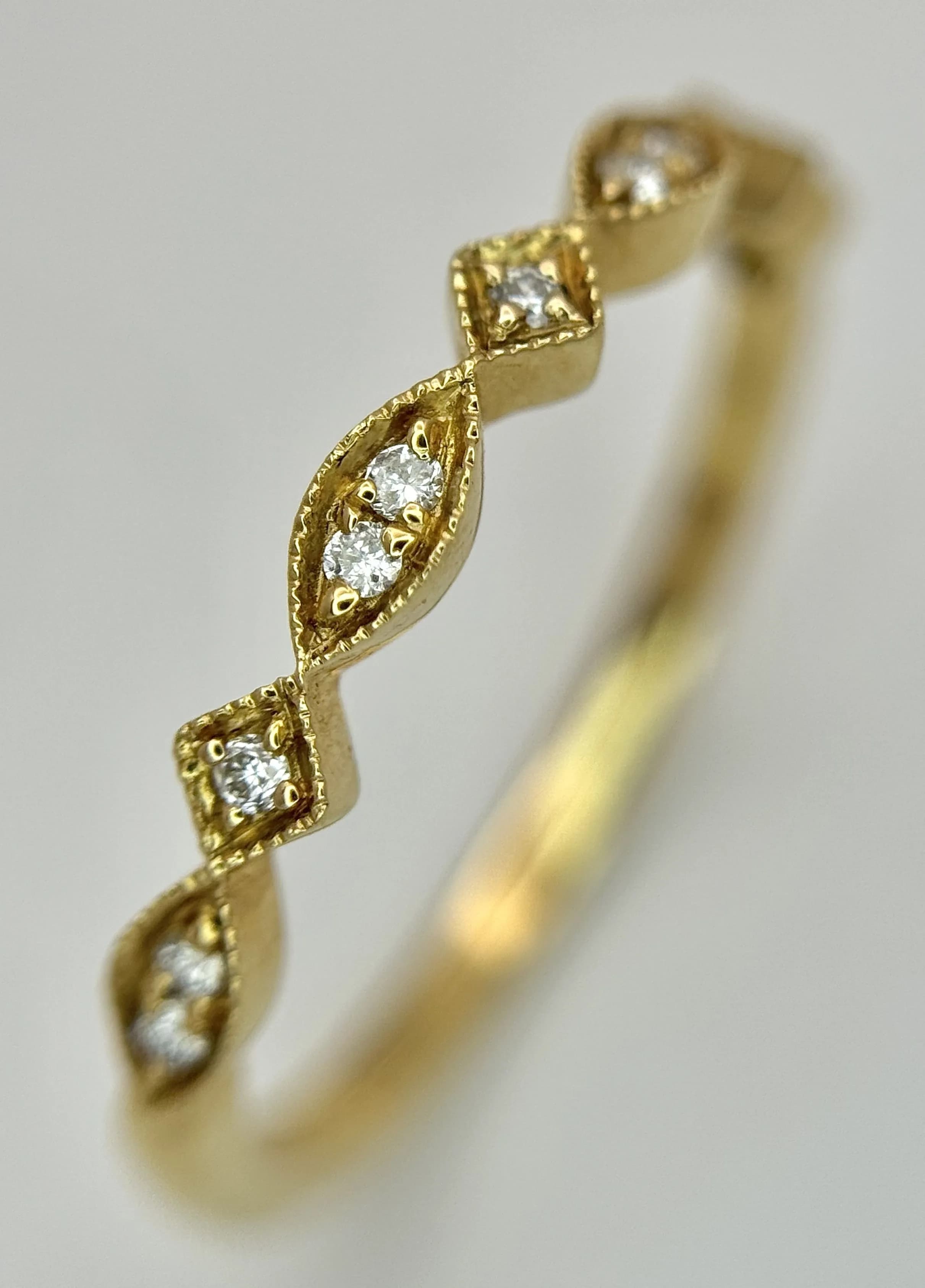 AN 18K YELLOW GOLD, DIAMOND SET, BEADED EDGE, BAND RING. 1.9G, SIZE N. SC 7066
