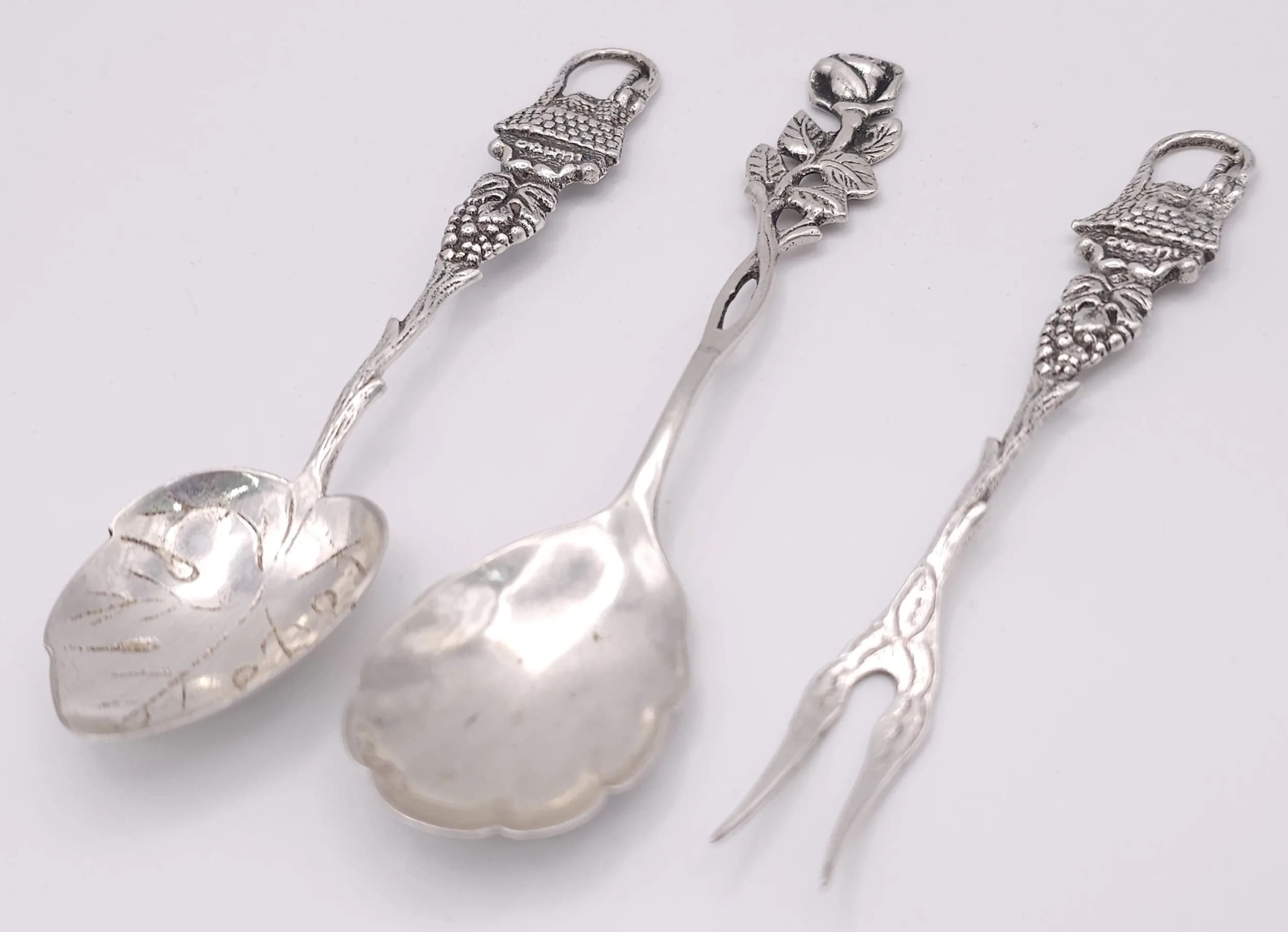 Three 800 Silver Flatware Pieces with Decorative Finials. 42.1g total weight.