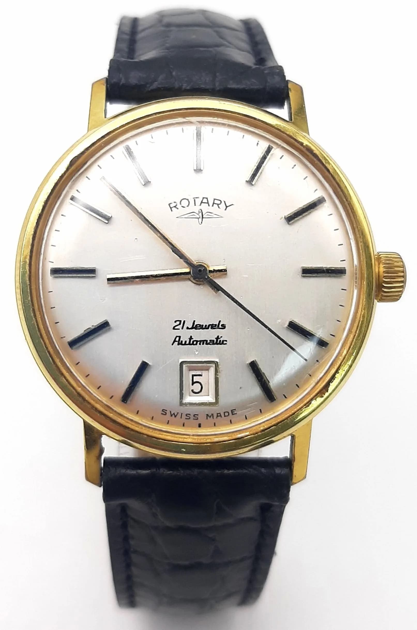 A Vintage Rotary Automatic Gents Watch. Black leather strap. Gilded stainless steel case - 34mm. 21 jewels. White dial with date window. In working order.