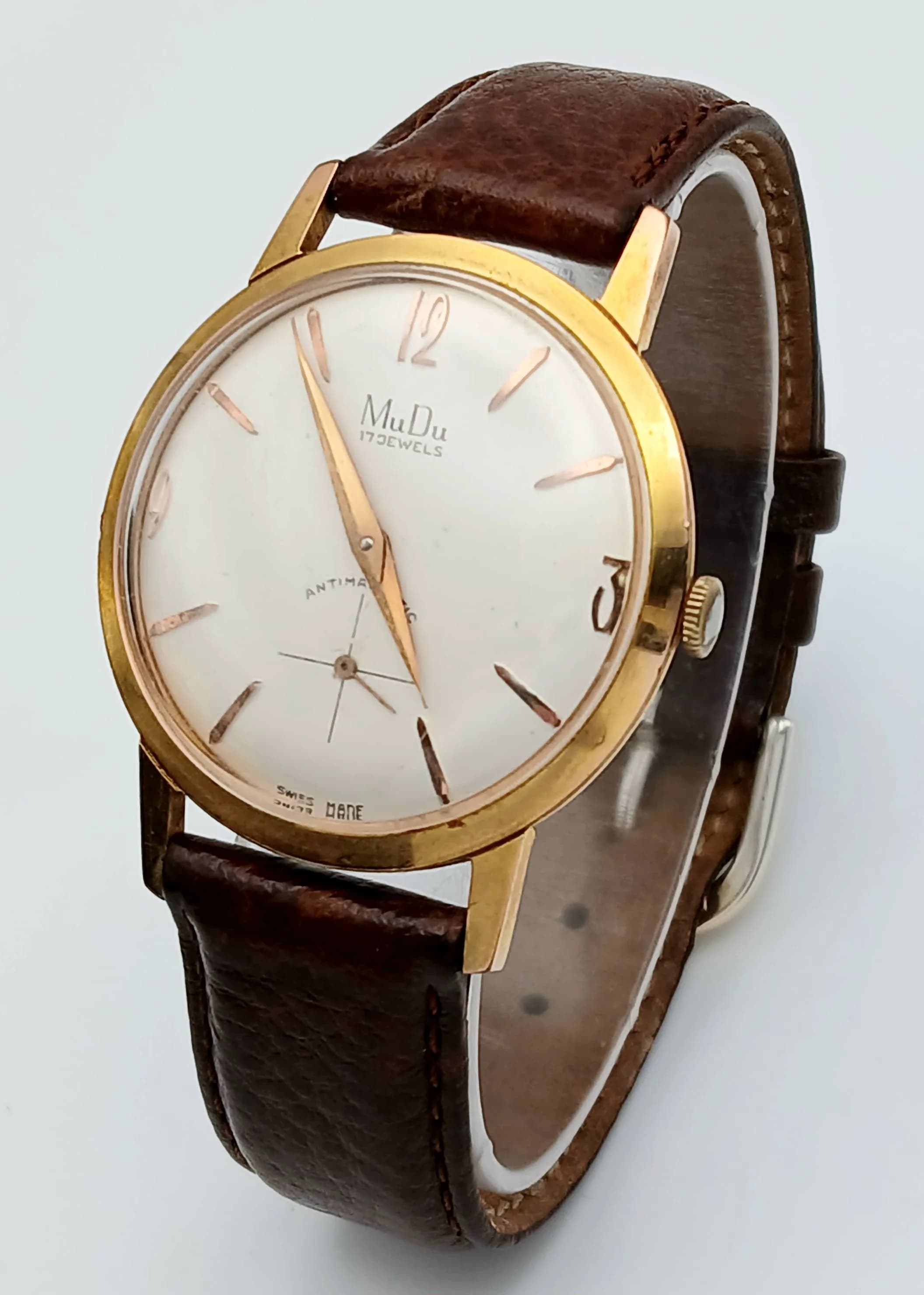 A Vintage Mudu Mechanical, Hand-Wind Gents Watch. Brown leather strap. Gilded stainless steel case - 34mm. White dial with second sub dial. In working order.