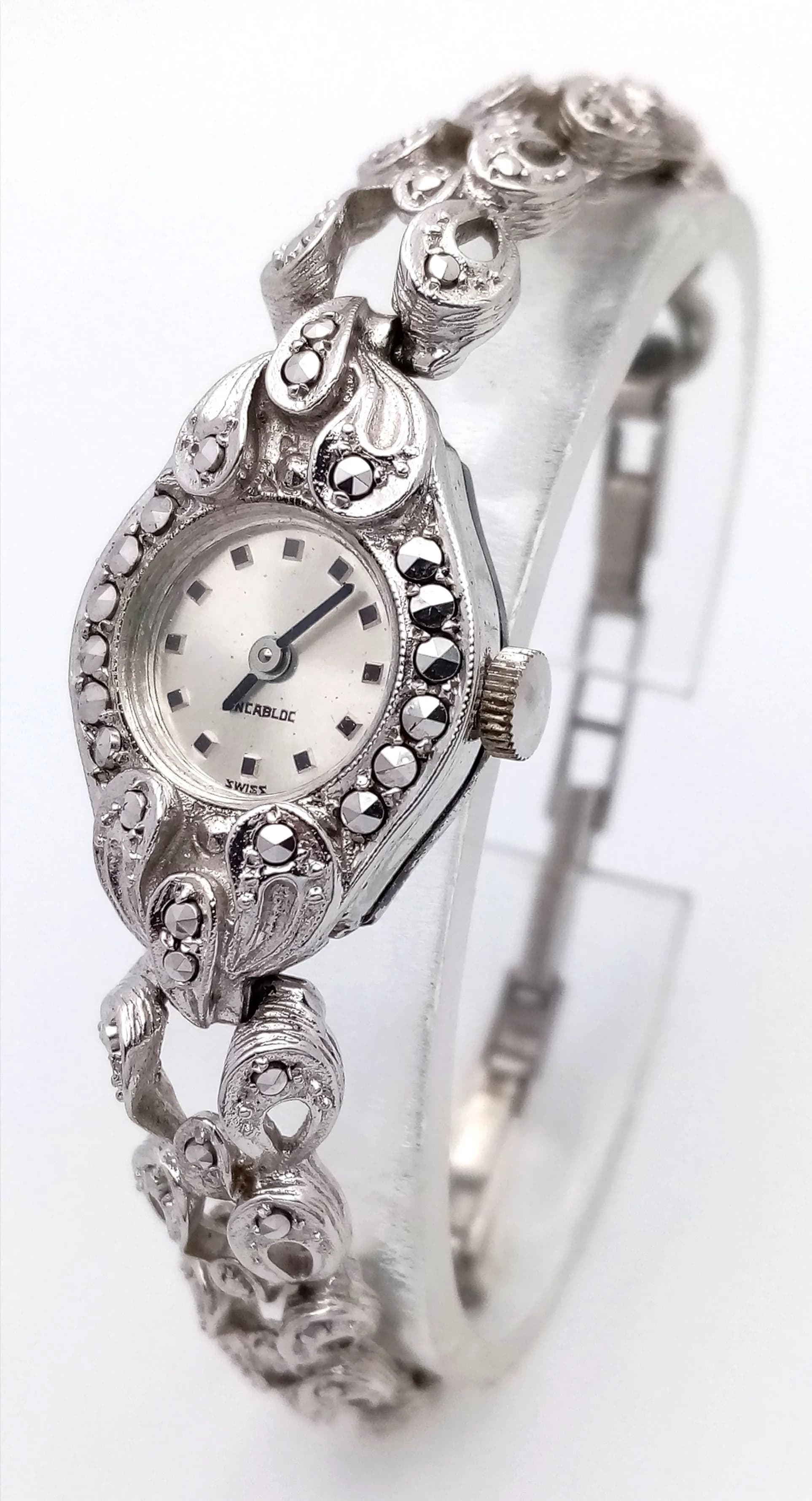 An Ornate Sterling Silver Ladies Watch. Hand-wind movement in working order. 26g total weight.