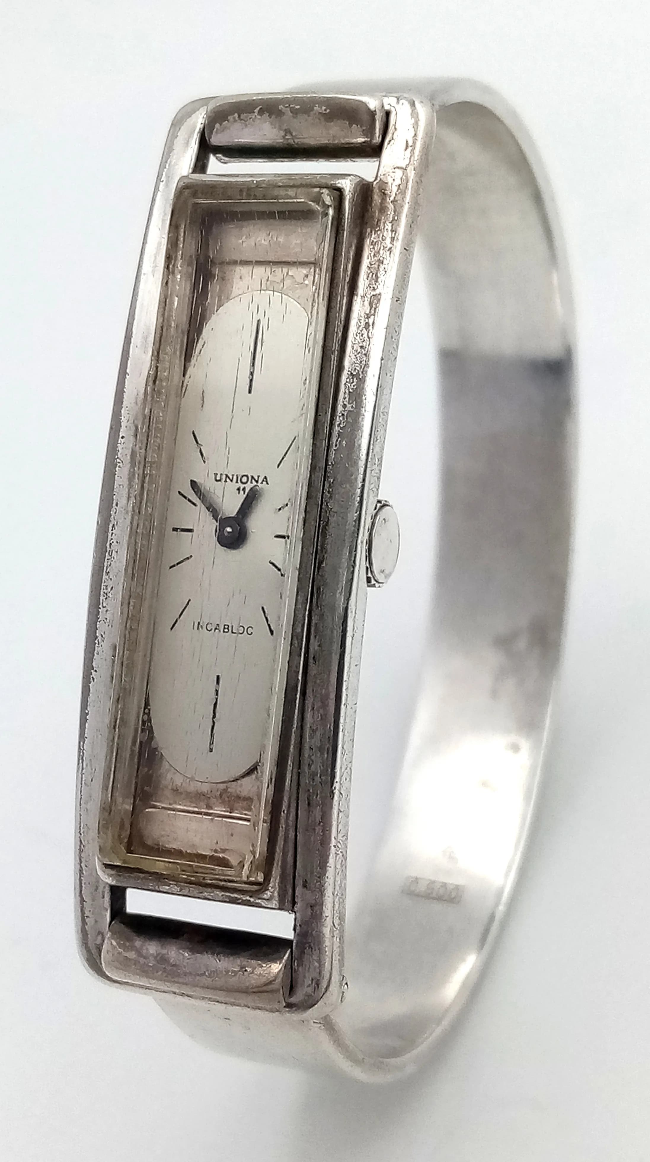 A Vintage Uniona, 800 Silver Ladies Watch. Clip open design. Rectangular case - 16 x 50mm. In working order. 48g total weight.