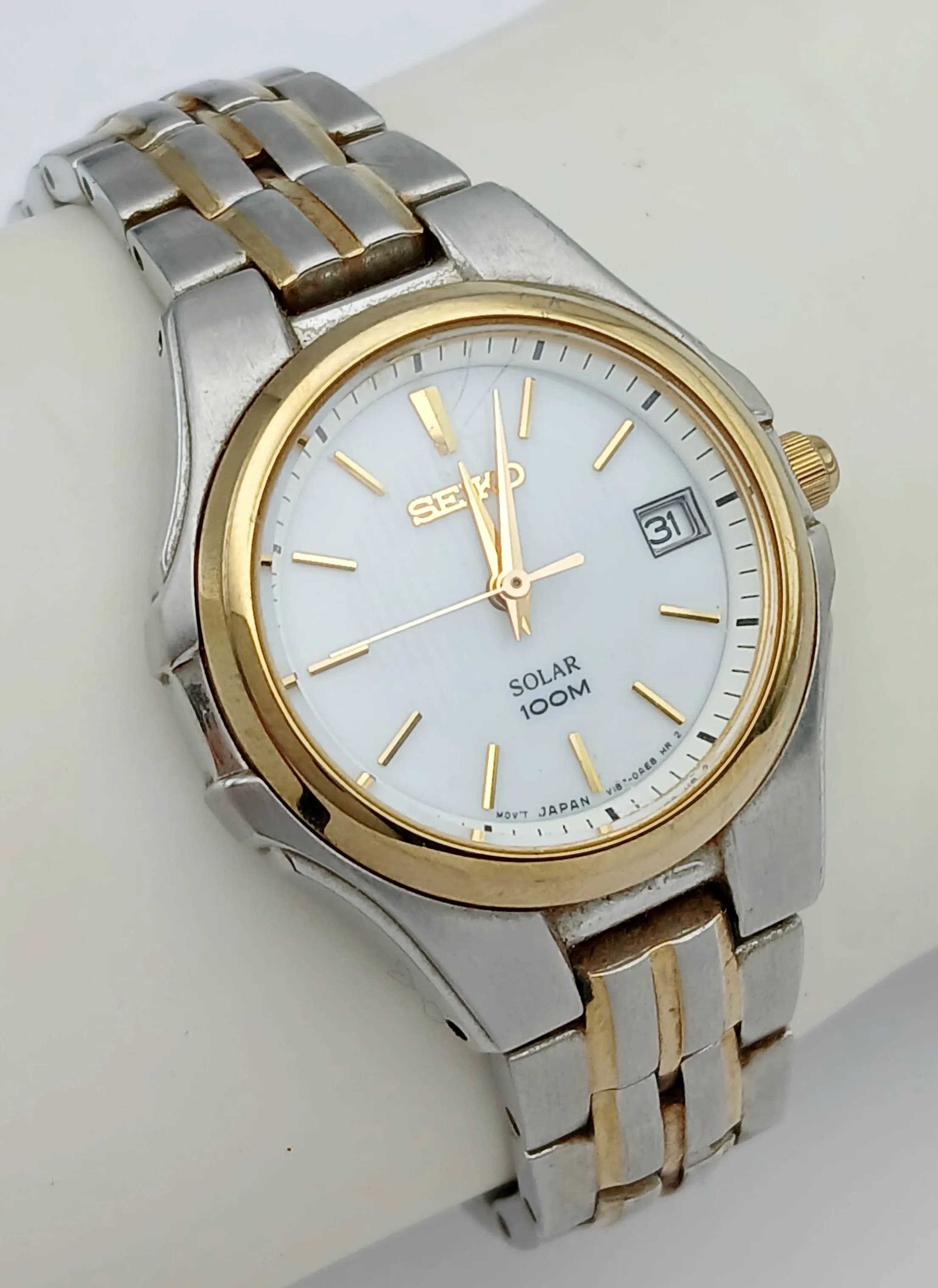 A SEIKO, SOLAR POWERED, 2 TONE, BRACELET WATCH WITH DATE FUNCTION. IN WORKING ORDER. S/A 1650 - 1
