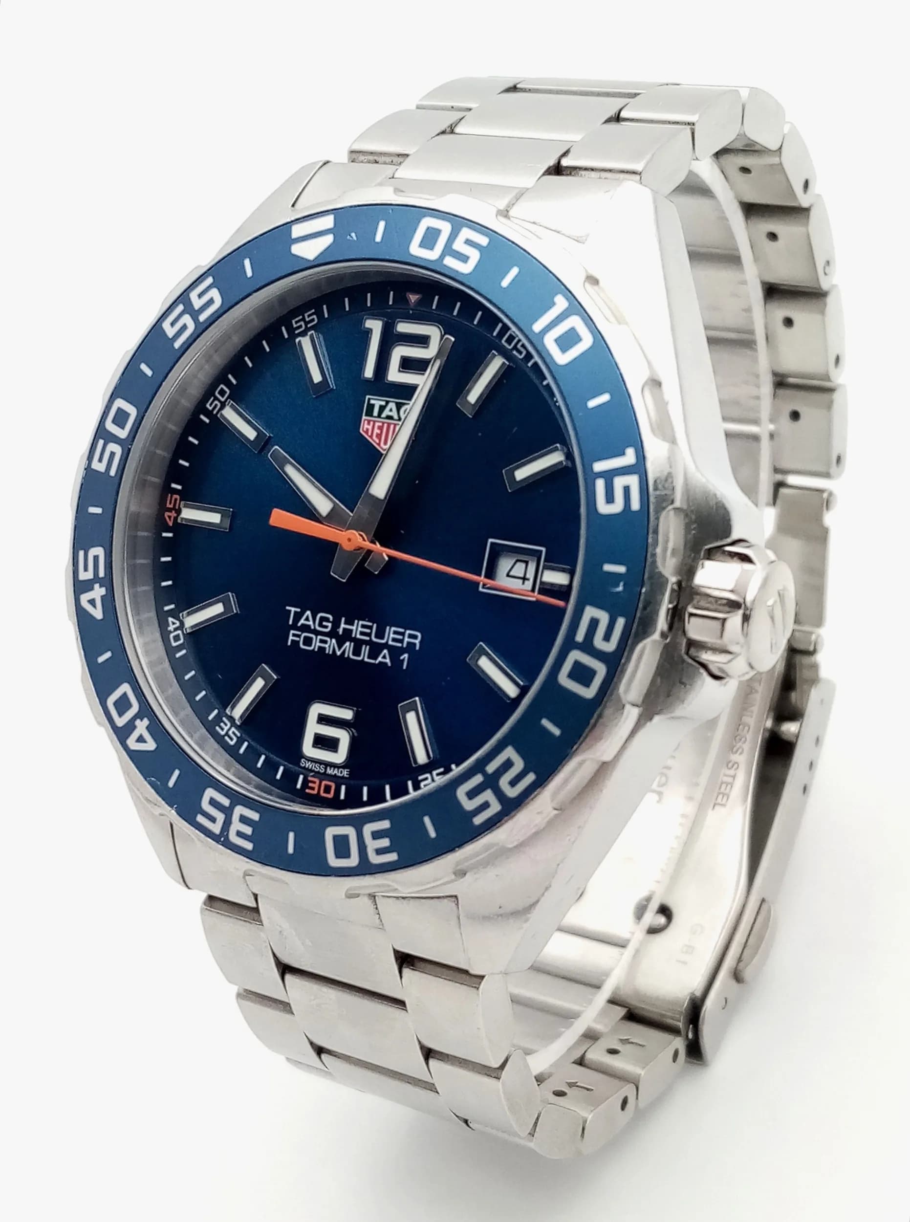 A Tag Heuer Formula 1 Quartz Gents Watch. Model WAZ1010. Stainless steel bracelet and case - 42mm. Blue dial with date window. Comes with spare links, box and papers. In working order.