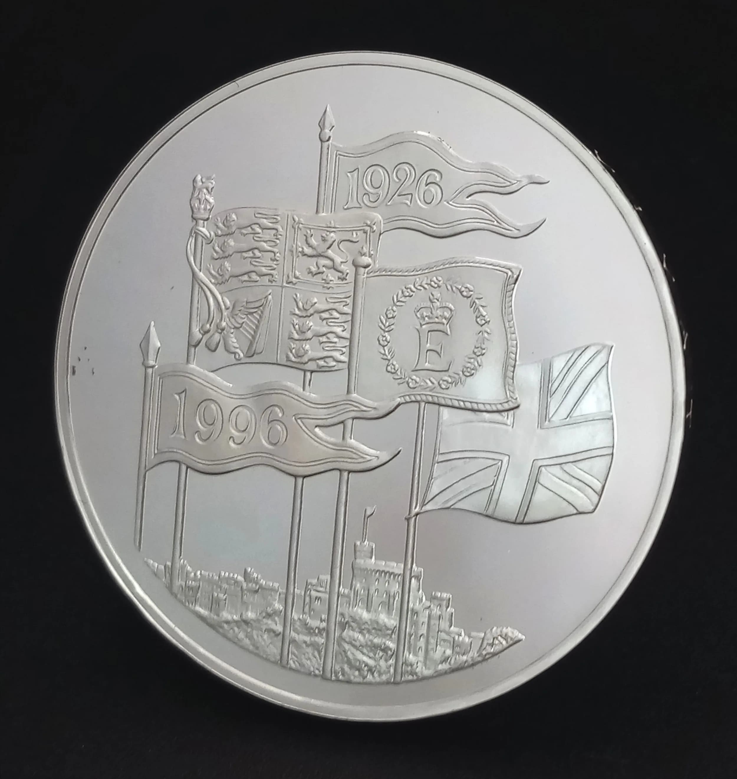 A 1996 Royal Mail Sterling Silver £5 Commemorative Proof Coin. Marking the 70th Birthday of Queen Elizabeth II. Encapsulated, with COA and case. 28.28g.