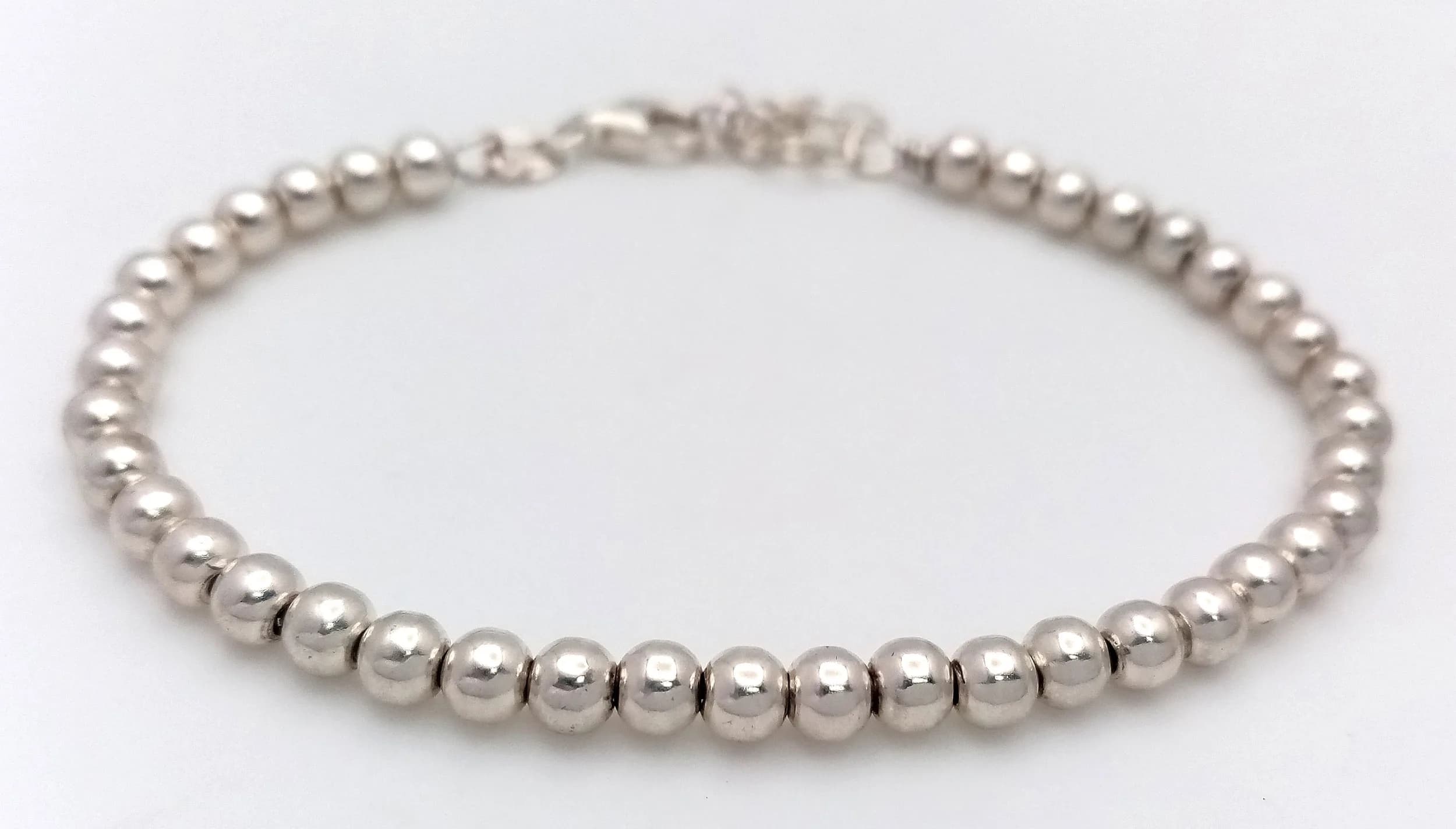 A STERLING SILVER, BALL BEARING STYLE LINK BRACELET. 4.7G. 3582