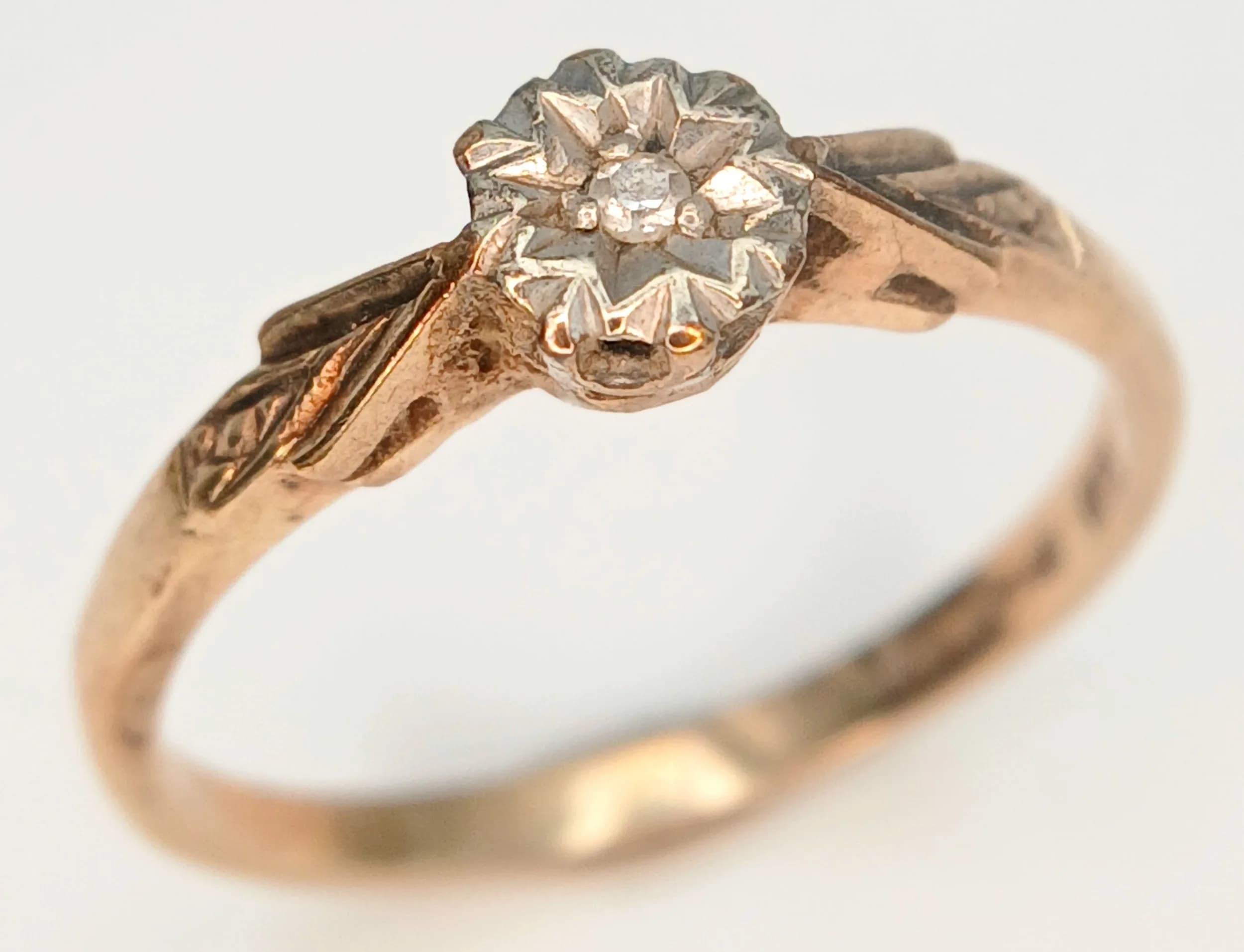 A 9K Yellow Gold Diamond Solitaire Ring. Single small diamond. Size N.