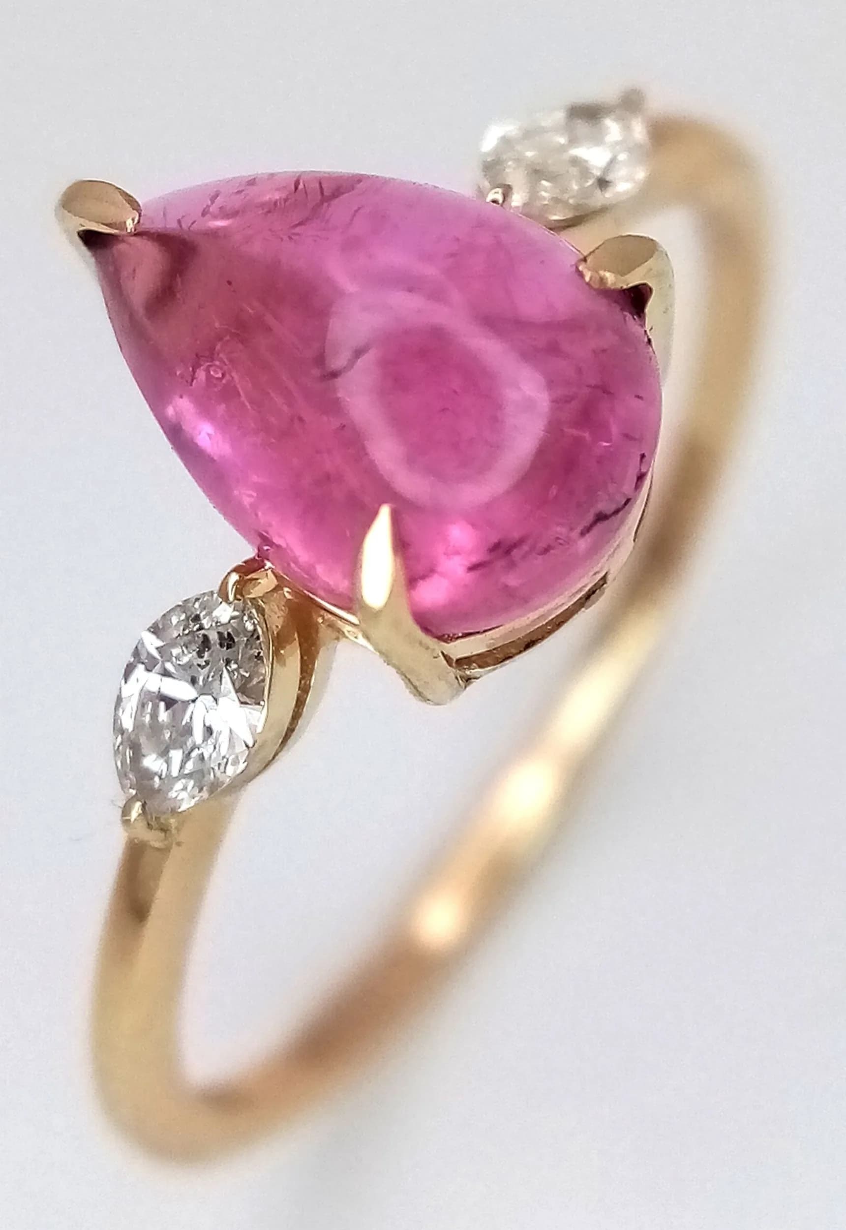 A 14K GOLD RING WITH A 1.9cwt PEAR CUT TOURMALINE FLANKED BY .16cwt OF DIAMONDS AND COMING WITH A H.R.D. ANTWERP CERTIFICATE . 1.69gms size N CLR 13320