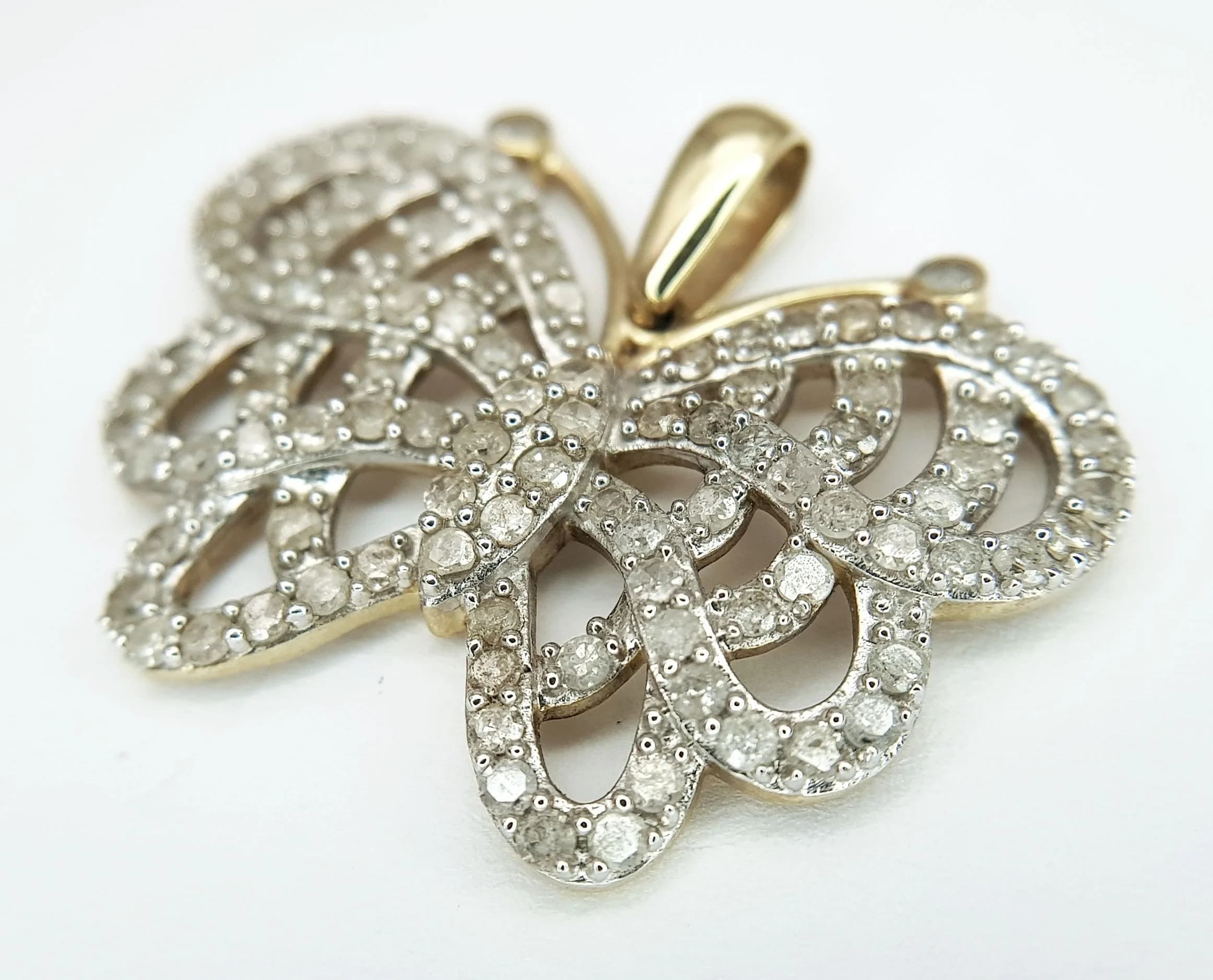 A 10K Gold, Diamond Encrusted Butterfly Pendant. 3cm wingspan. 4.65g total weight. Ref: 029577.