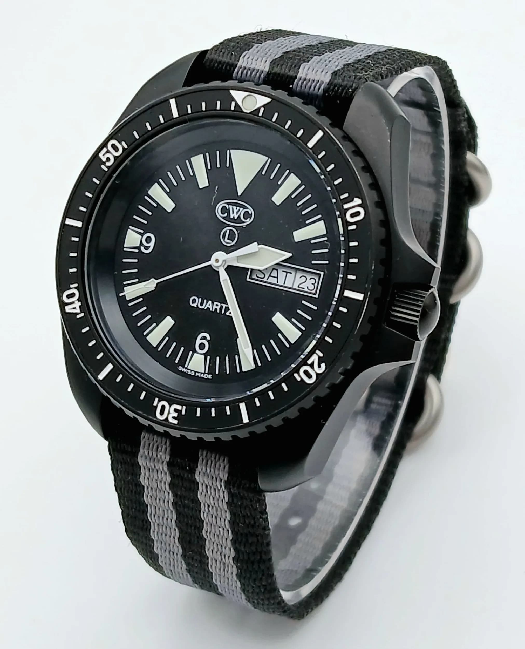 An Excellent Example, CWC (Cabot Watch Company) Full Military Specification SBS Divers Quartz Date Watch. Broad Arrow on Case Back. Reference 0565/6645-99- 7995443 (972-22)-40mm Case. Nato Strap. Comes in Military Travel Case.
