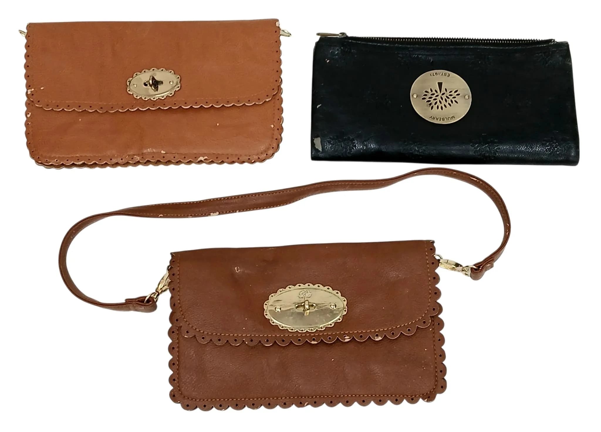 A Group of Three Mulberry Leather Bags. Comprising two brown leather examples with scalloped trim and turn lock closure, and one black embossed leather example with gold-tone zip fastening. Each bag has a dark brown textile interior with one main compartment. Some marks, signs of wear and tear to the leather, some scratches to the hardware. Brown bags approx. 26cm x 16cm and 25cm x 26cm. Black bag approx. 27cm x 14cm when folded. Please see photos or request a condition report.