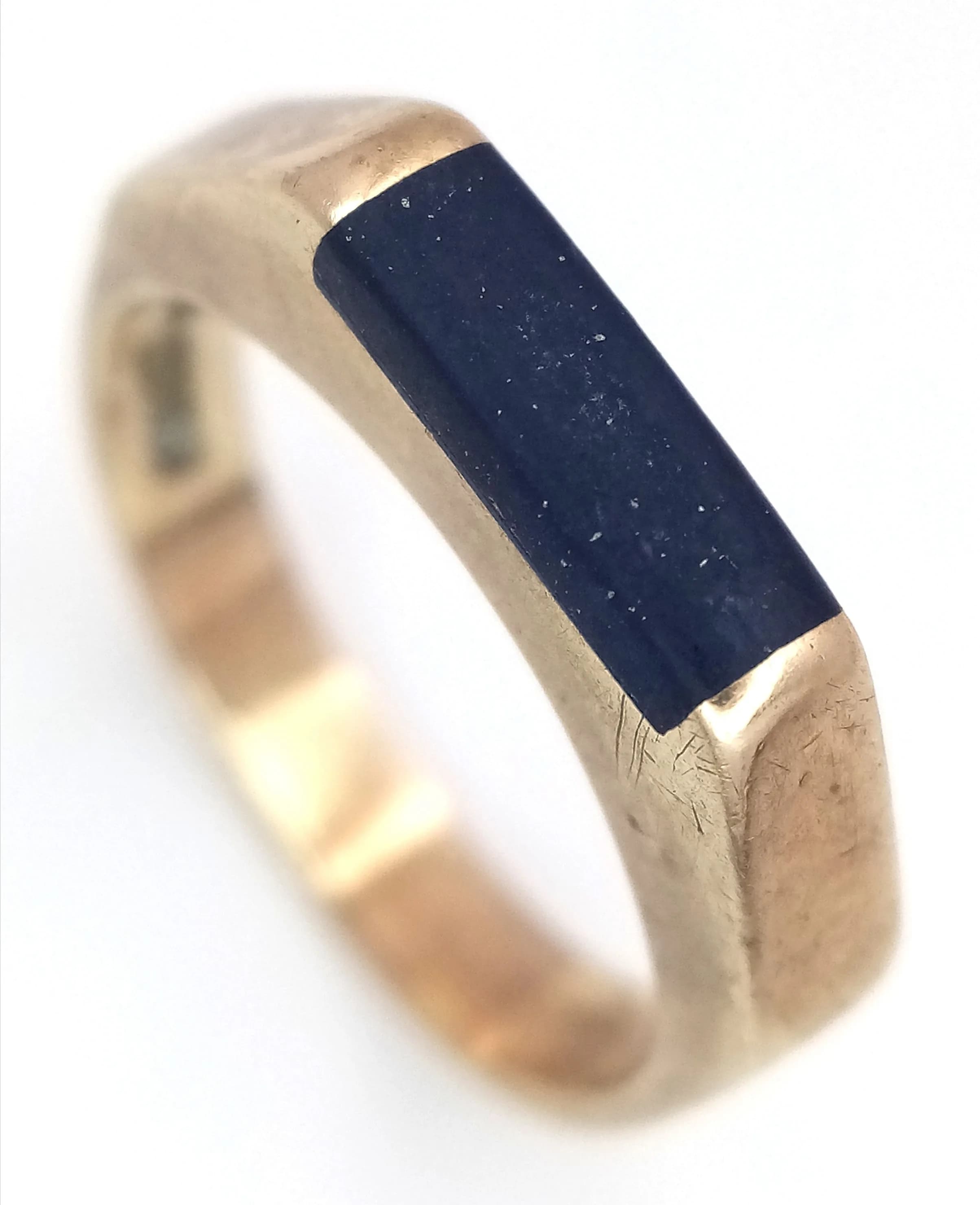 A 9K Yellow Gold Onyx Signet Ring Featuring a Rectangular Onyx Inlay. 3.5g total weight. Size N.