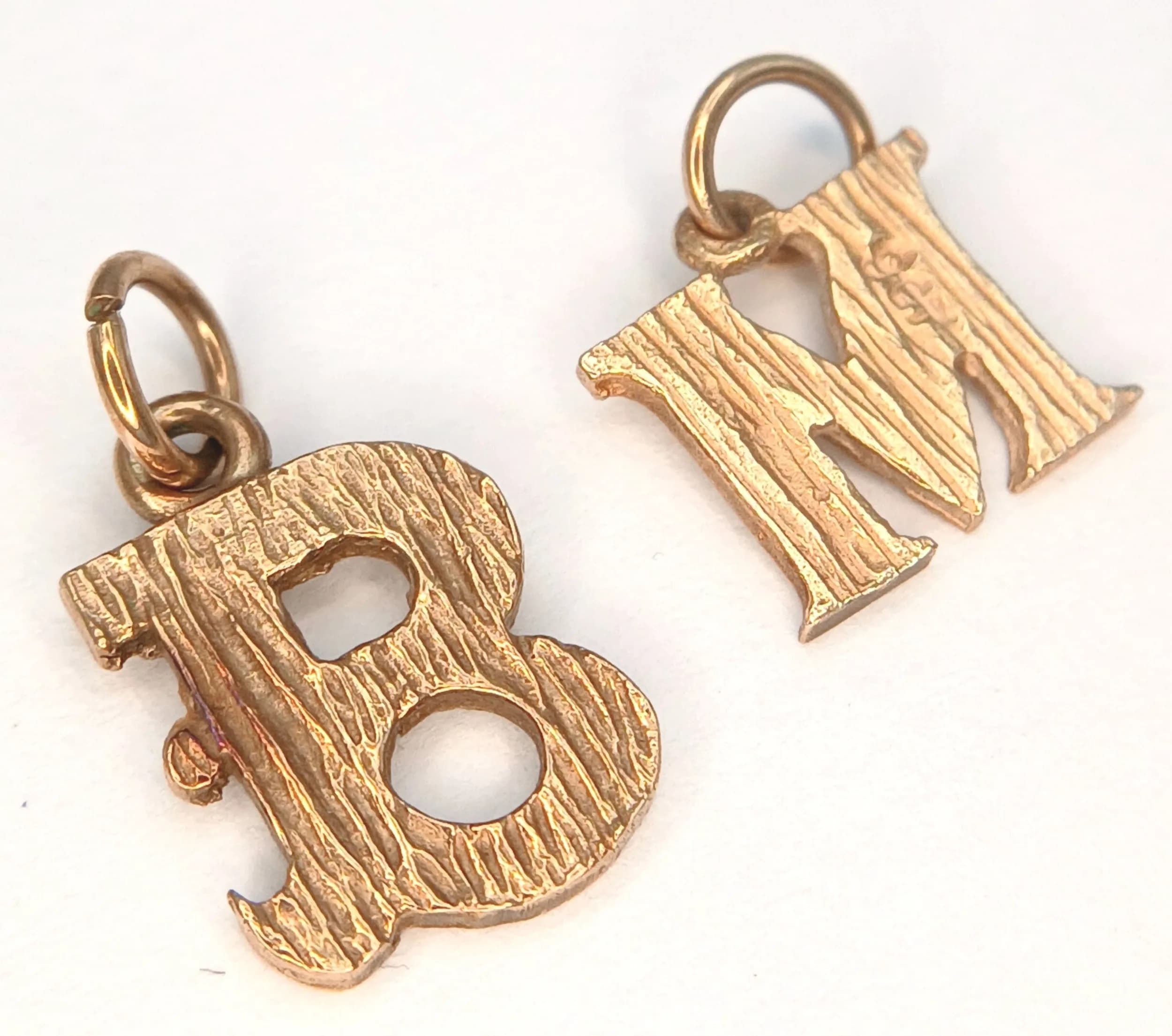 Two 9K Yellow Gold Letter Pendants. 'M' and 'B'. 12mm. 1.4g.