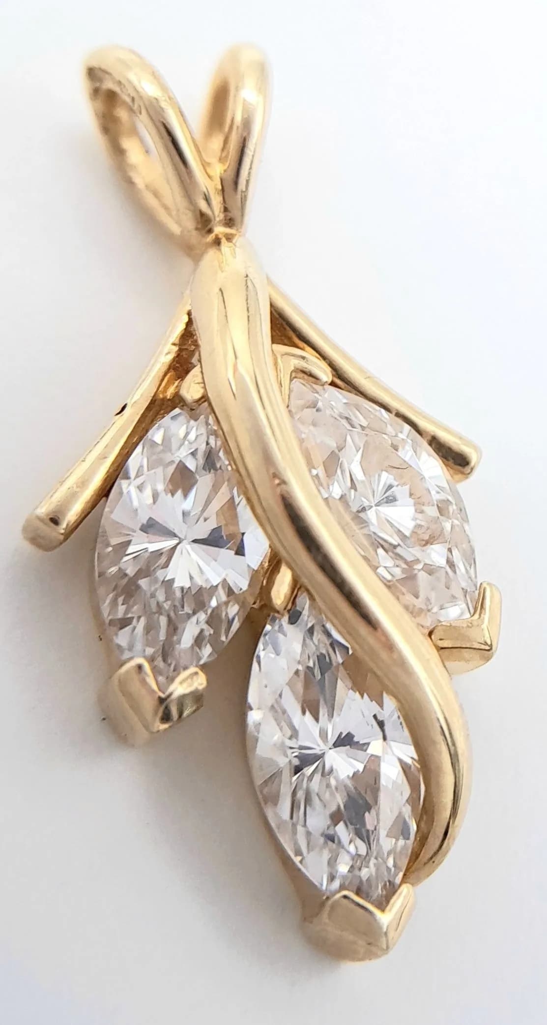 An Attractive 14k Yellow Gold Marquise Cut Diamonique Cubic Zirconia Pendant. 2.3 x 1.2cm. Set with Diamonique grade CZ therefore better quality than standard CZ giving Diamond appearance Gross Weight 2.51 grams.