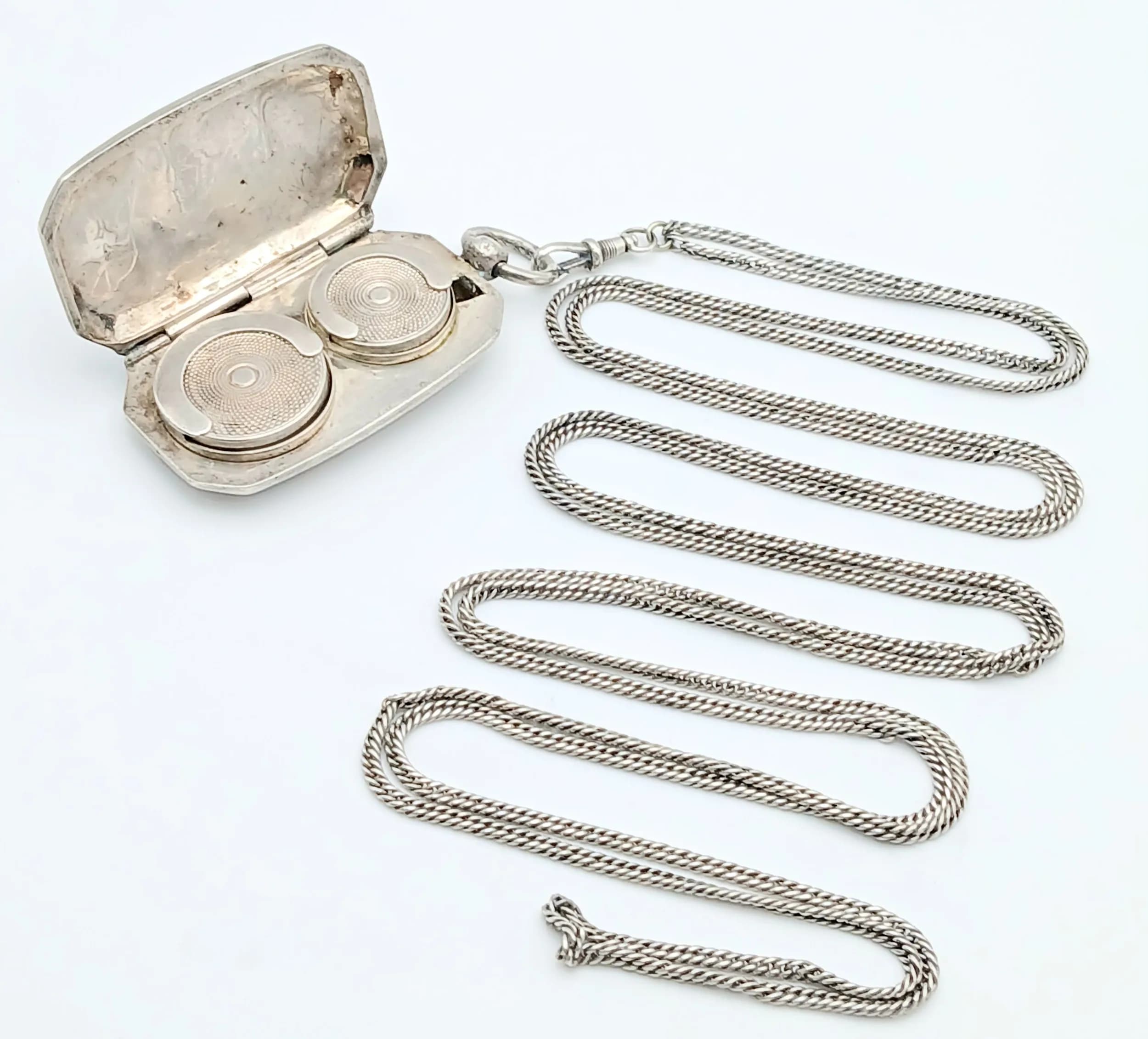 A White Metal Half and Full Sovereign Holder Pendant on a Long White Metal Chain. Pendant clasp needs attention. 6cm and 150cm.