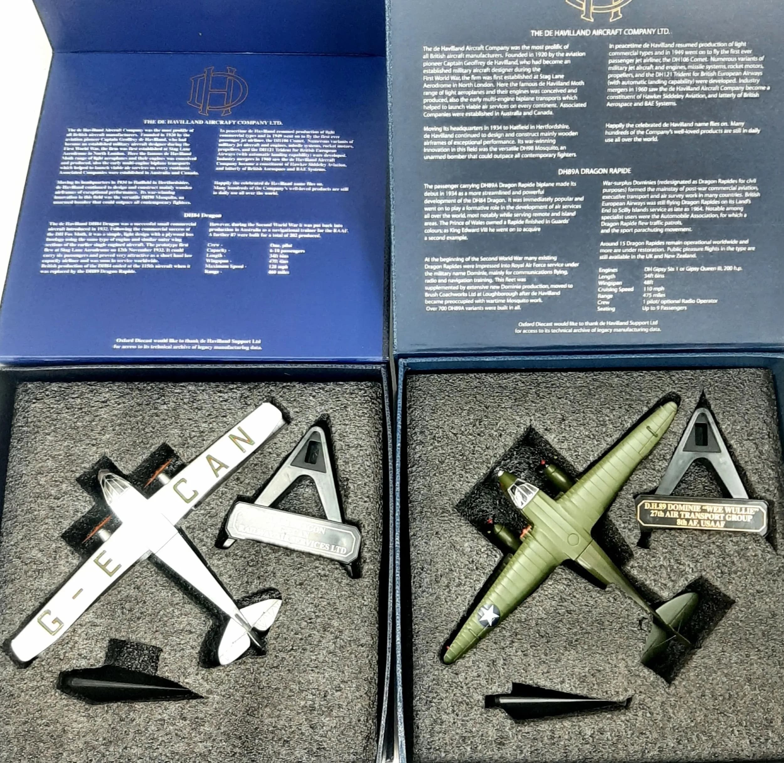 Two Oxford 1/72 scale die cast model aeroplanes. To include a D.H.84 Dragon railway air services and a D.H.89 Dominie "Wee Wullie", 27th air force group. In good condition, these have never been on display.
