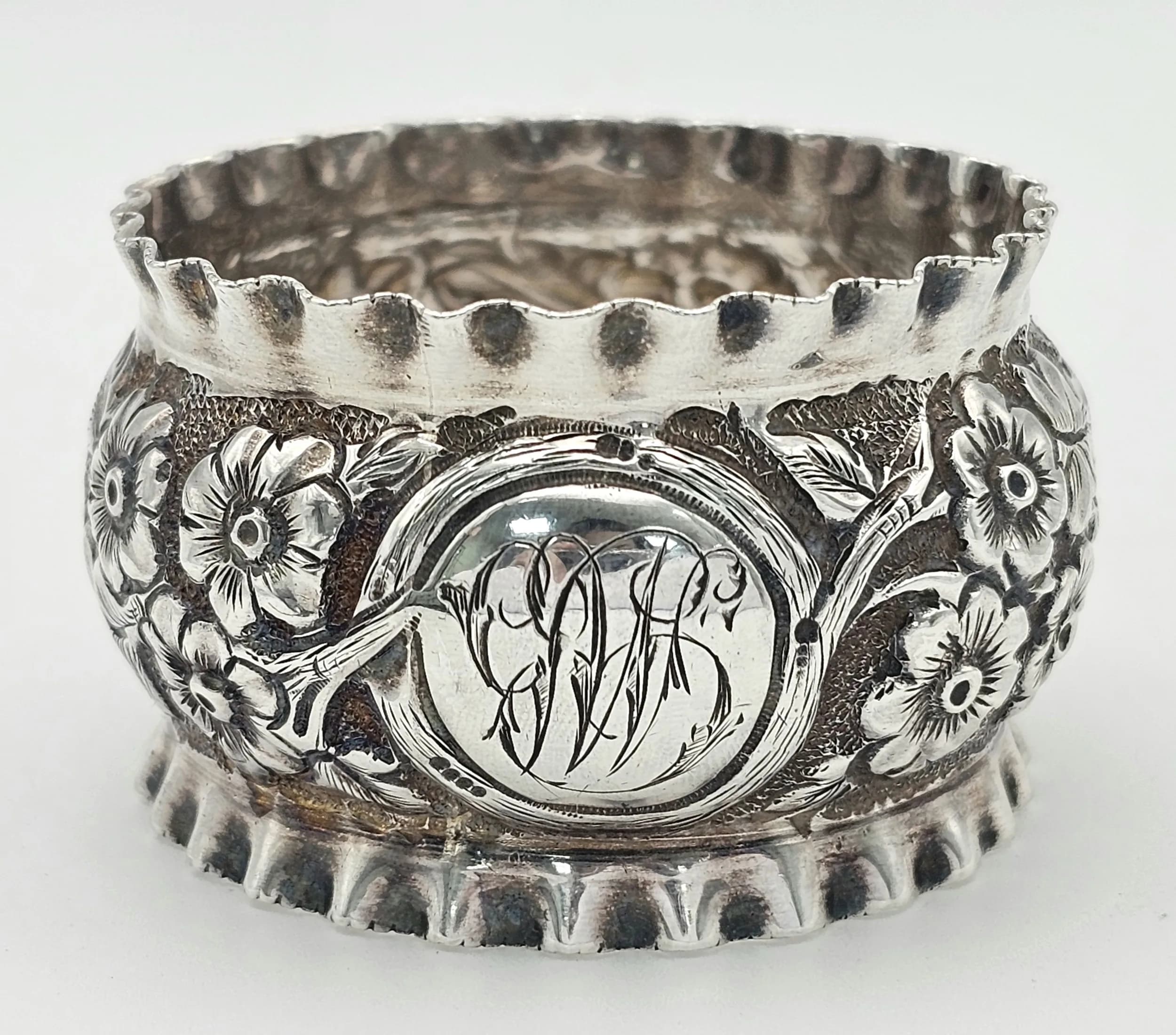 A Beautiful Antique Chased Napkin Ring. Faded hallmark. 21.8g.