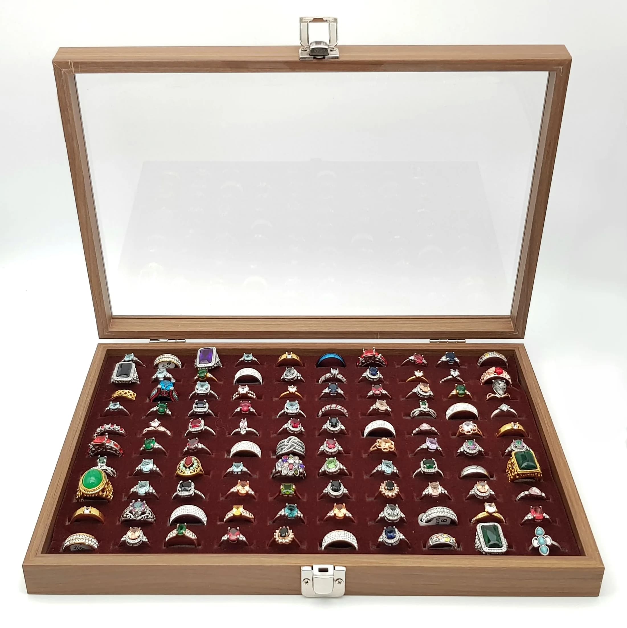 A Jewellery Display Case with 100 Rings! An absolutely fabulous lot with different colored stones to acrylic/resin decoration. All types of stone cuts with gilded and white metal shanks of different design. Sizes range from small to large. All rings in excellent condition. Case size - 35 x 24cm.