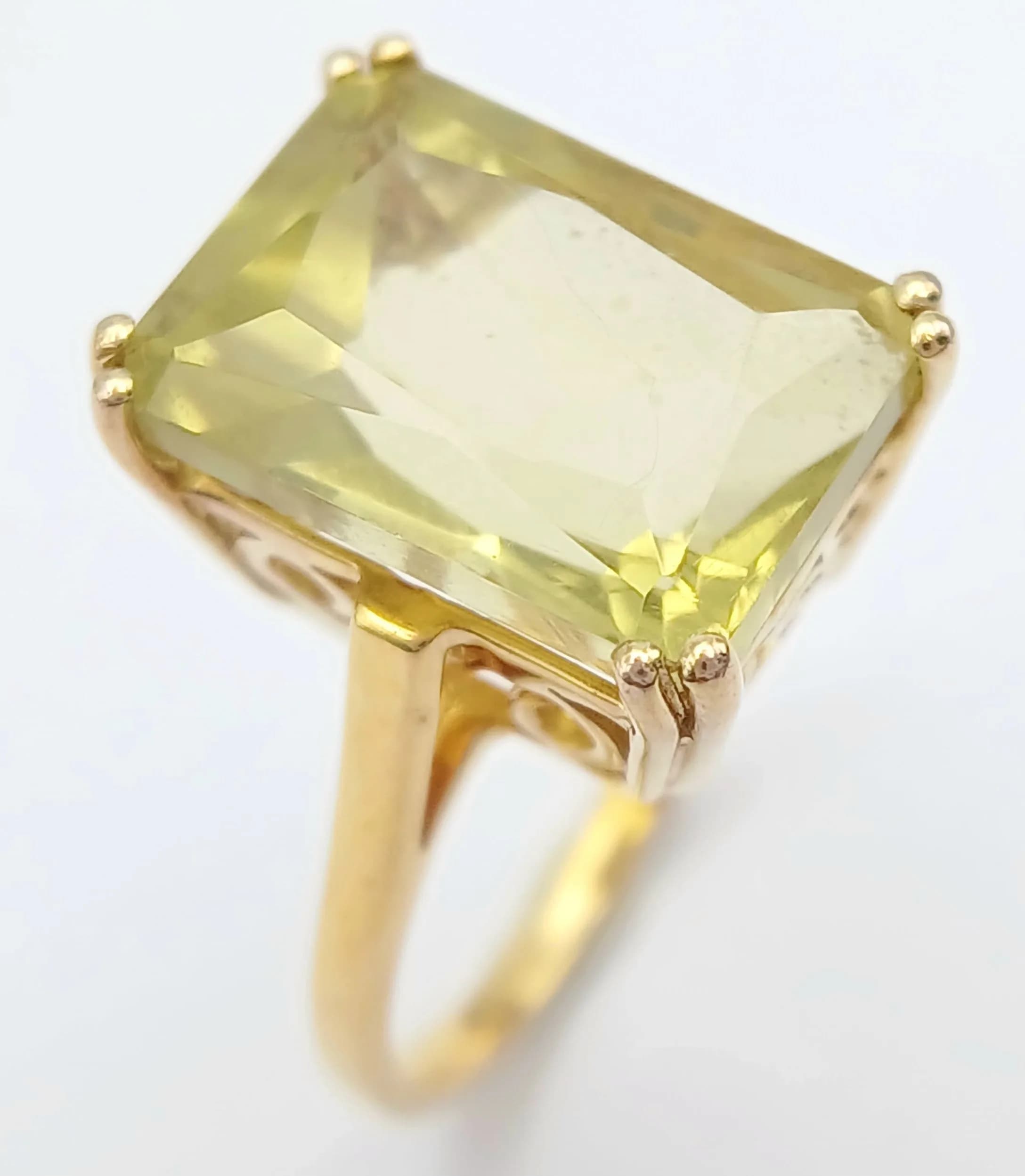 A Gild Gilded Sterling Silver Gallery Set Citrine Ring Size M1/2. The Ring is set with a 14 x 10mm Rectangular Cut Citrine, approximately 7.5 carat. Gross Weight 4.34 grams.