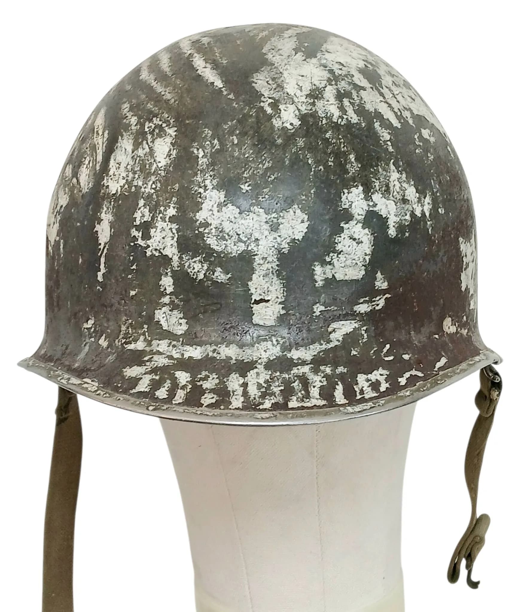 A Patinaed USA M1 Helmet with Chin-Strap. Triangular mark on inner with 1953.
