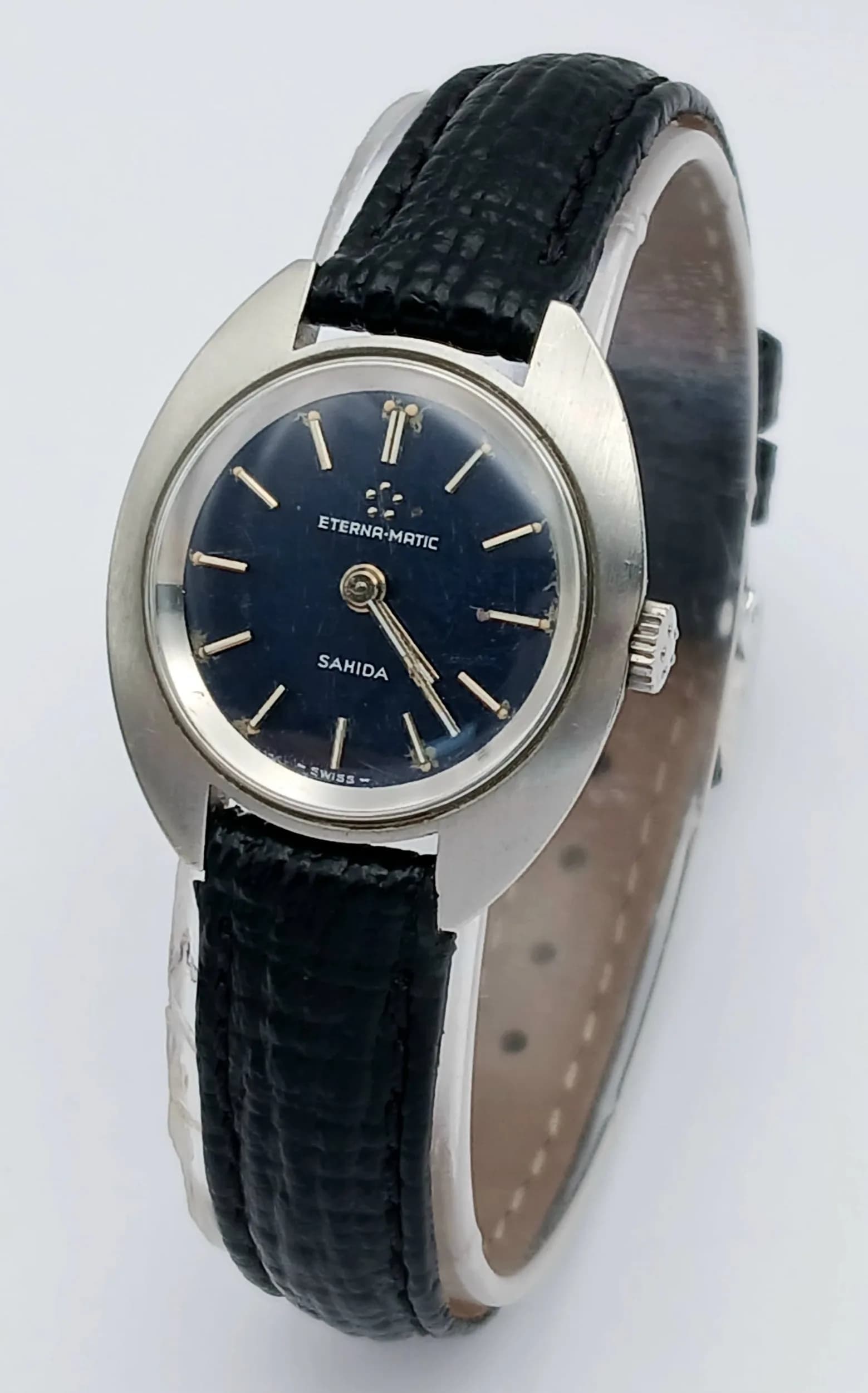 AN ETERNA MATIC, SAHIDA, BLUE DIAL, MANUAL WIND, LEATHER STRAP WATCH. IN WORKING ORDER. S/A 1707 - 3