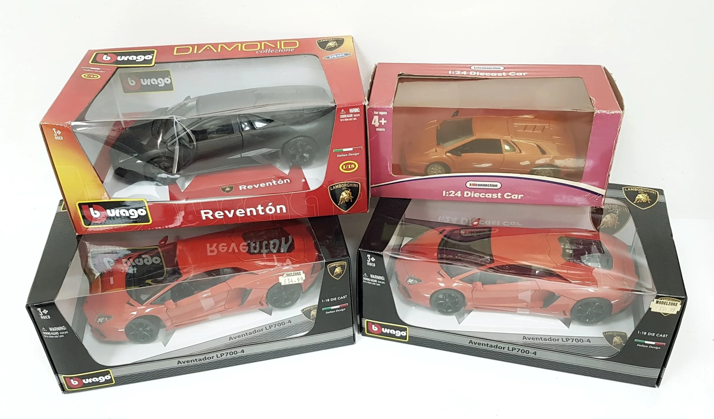 Four die cast Lamborghini models. 1/18 & 1/24th scale by Burago & kid connection. Some wear to boxes from storage, models in good condition.
