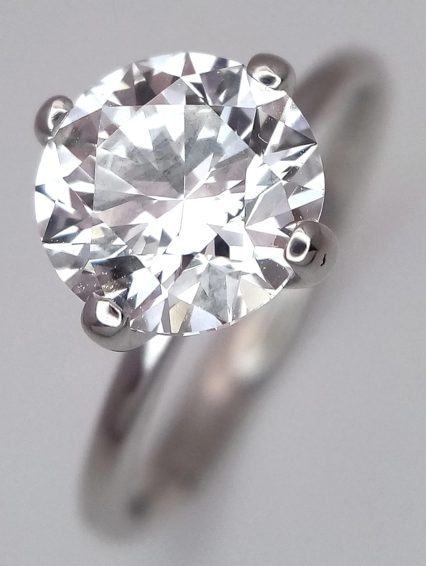 An 18K White Gold, Lab Diamond Solitaire Ring. 1.9ct round brilliant cut diamond having F colour and VS2 clarity. 2.8g total weight. Size L 1/2. Ref: 18/B4005.