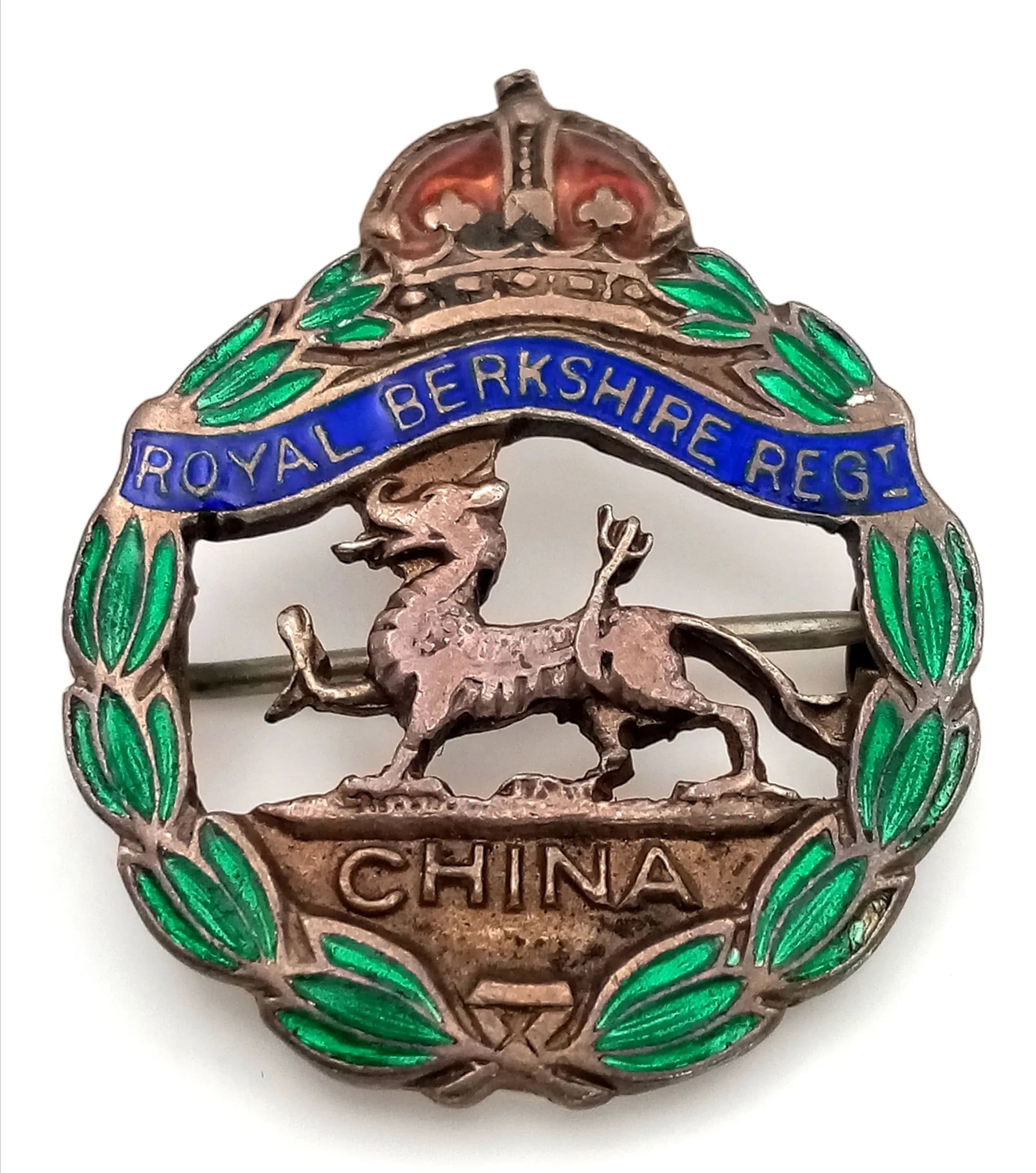 A Royal Berkshire Regiment Silver and Enamel Badge. China wording and Dragon form. 2.5cm. 6g.