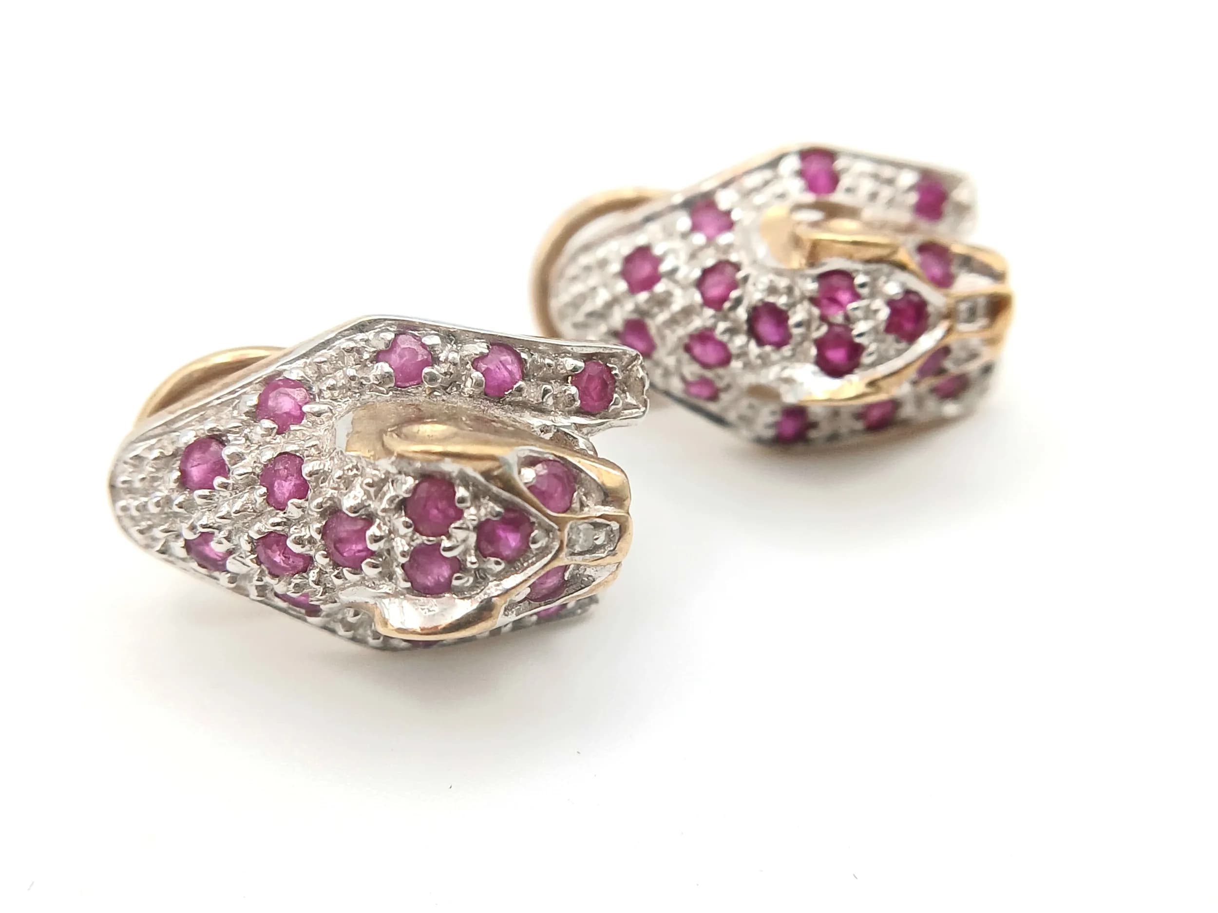 A Pair of 9K Yellow and White Gold Earrings in Ruby Set Leopard Head Form. 4.9g total weight.