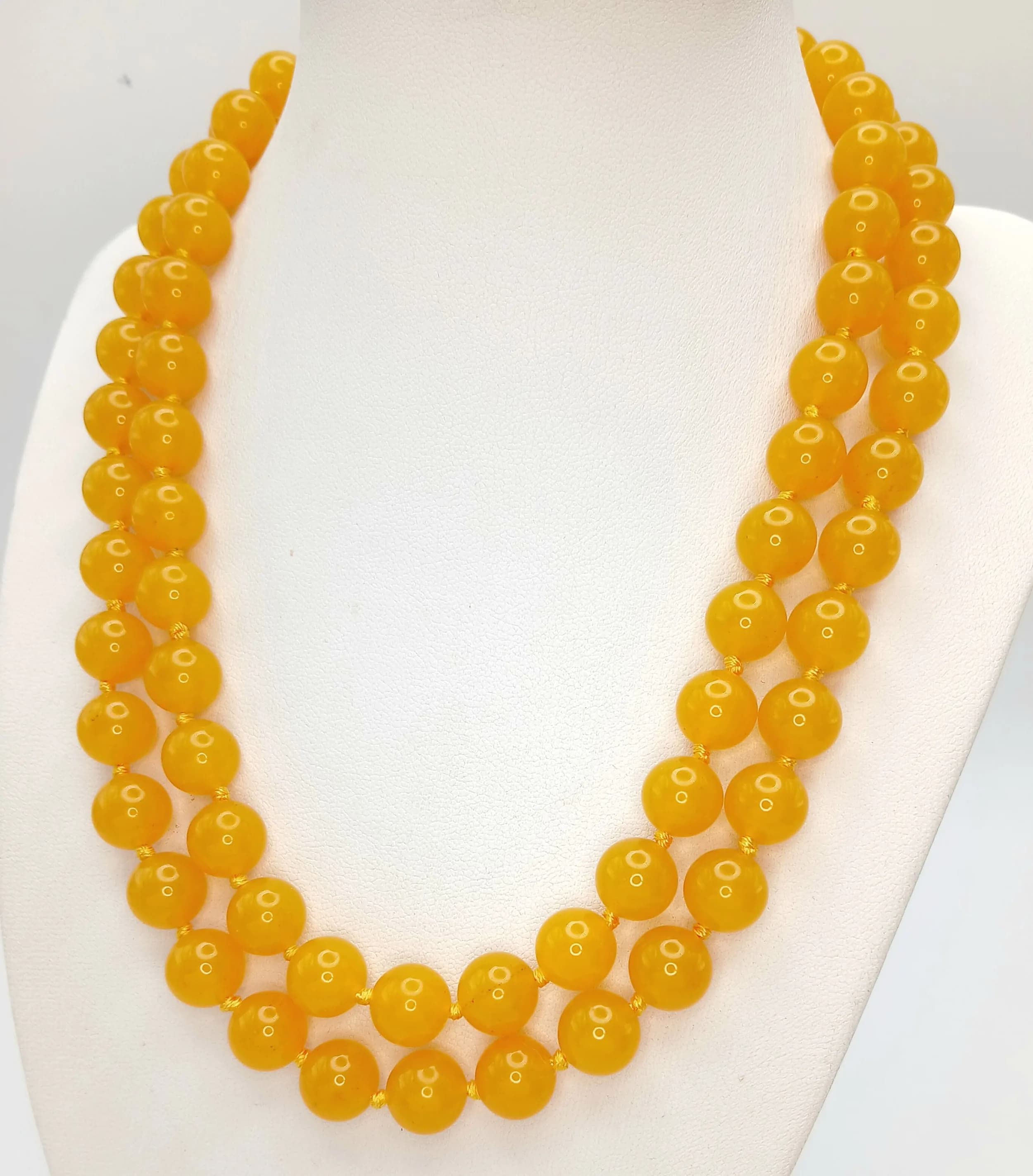 A Yellow Jade Matinee Length Beaded Necklace. 10mm beads. 84cm length.