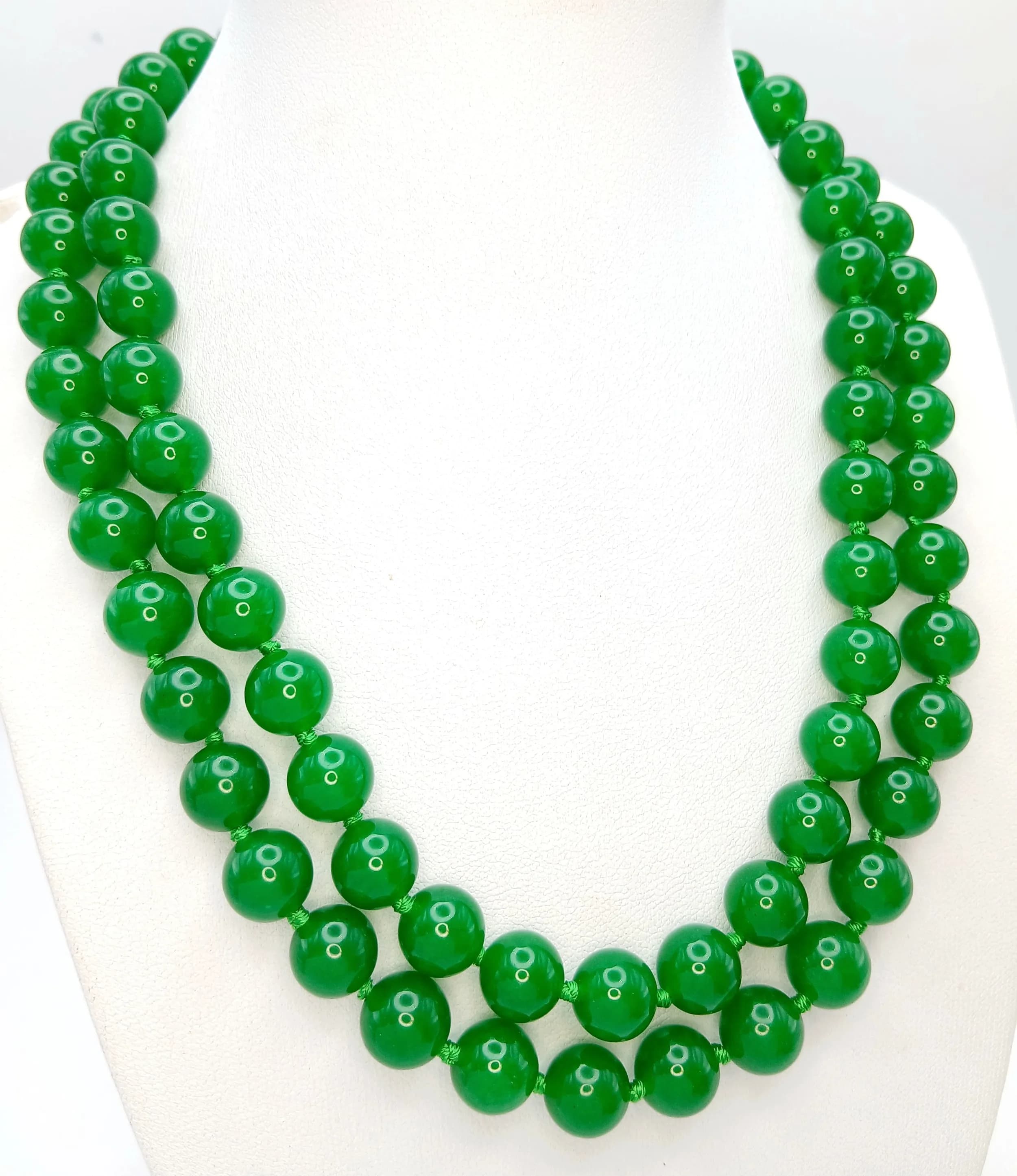 A Matinee Length Apple Green Jade Beaded Necklace. 10mm beads. 92cm length.